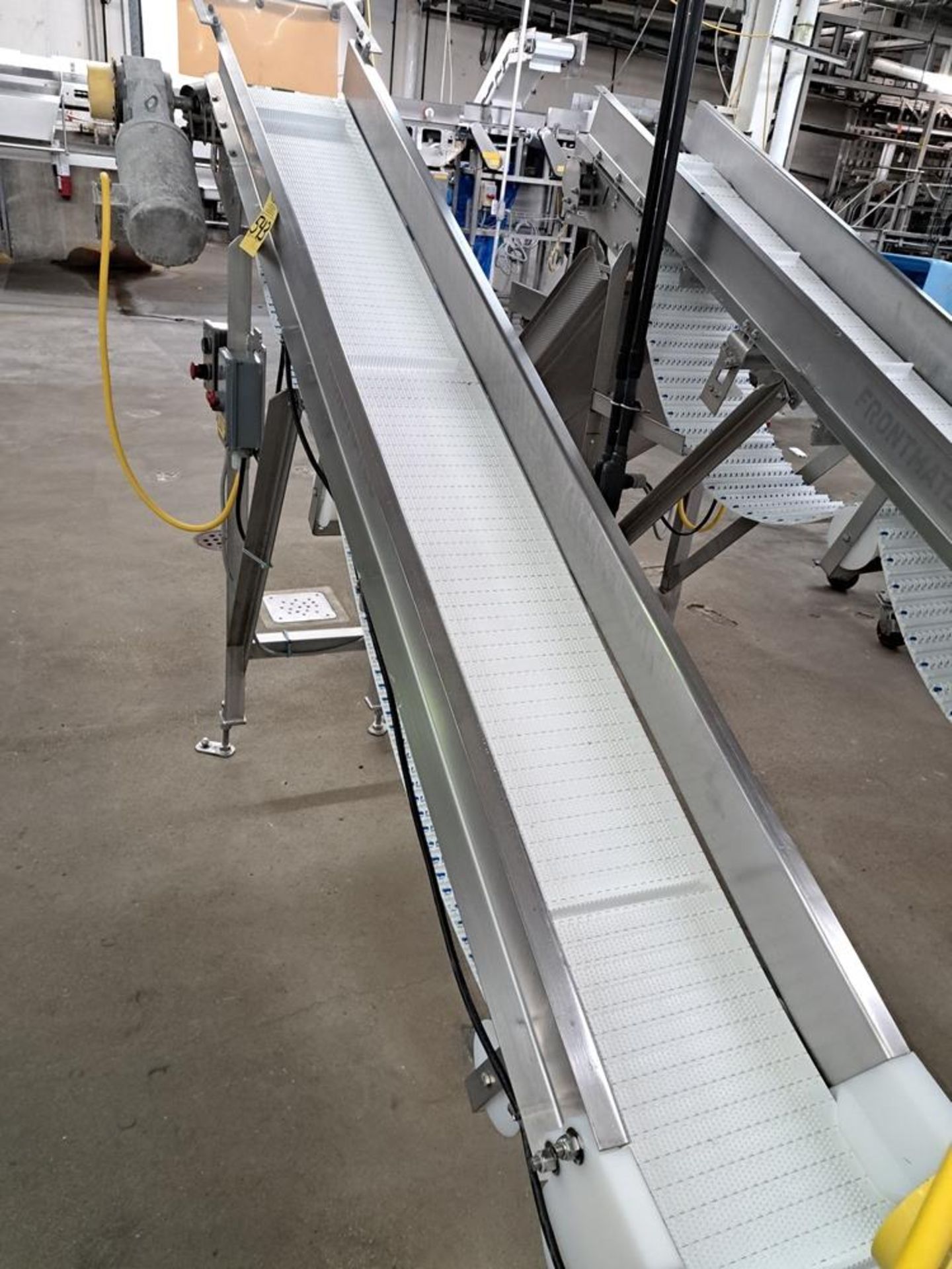 Stainless Steel Incline Conveyor, 12" W X 12' L infeed, 65" discharge, belts have been added to