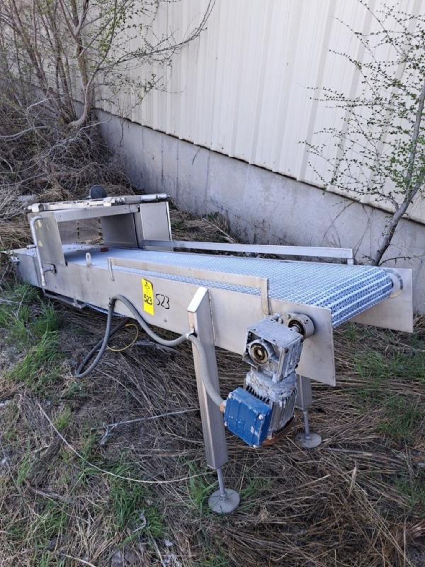 Stainless Steel Conveyor with spray bar, 18" W X 112" L plastic belt, 230/460 volt motor (Located in