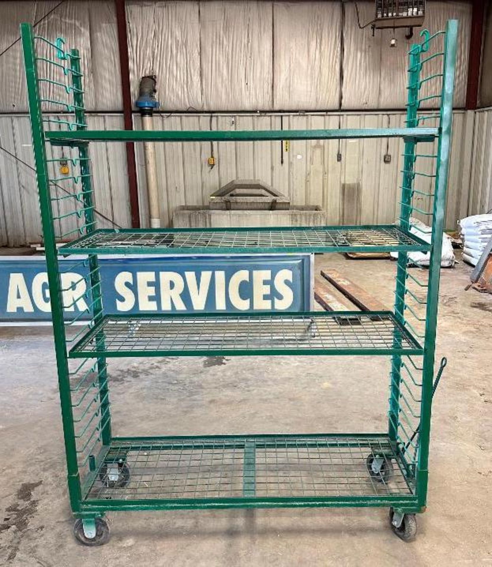 4-TIER HEAVY DUTY SHELVING RACK ON CASTERS SIZE: 60" X 21" X 80" LOCATION: MAIN WAREHOUSE