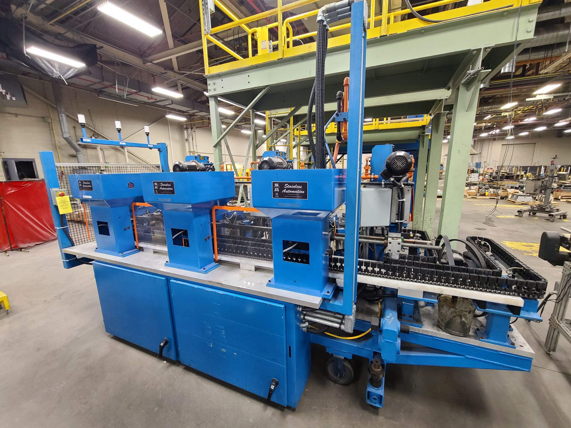 STAINLESS AUTOMATION CAP FEEDER WITH (3) BOWL FEEDERS