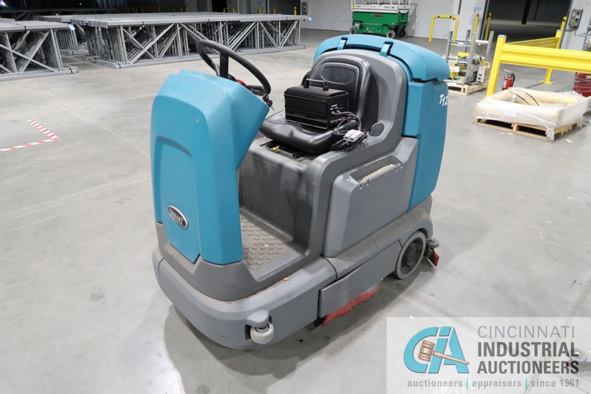 TENNANT MODEL M-T12 SIT DOWN ELECTRIC FLOOR SCRUBBER; S/N T12-11034968, 36 VOLT, 264 HOURS, WITH