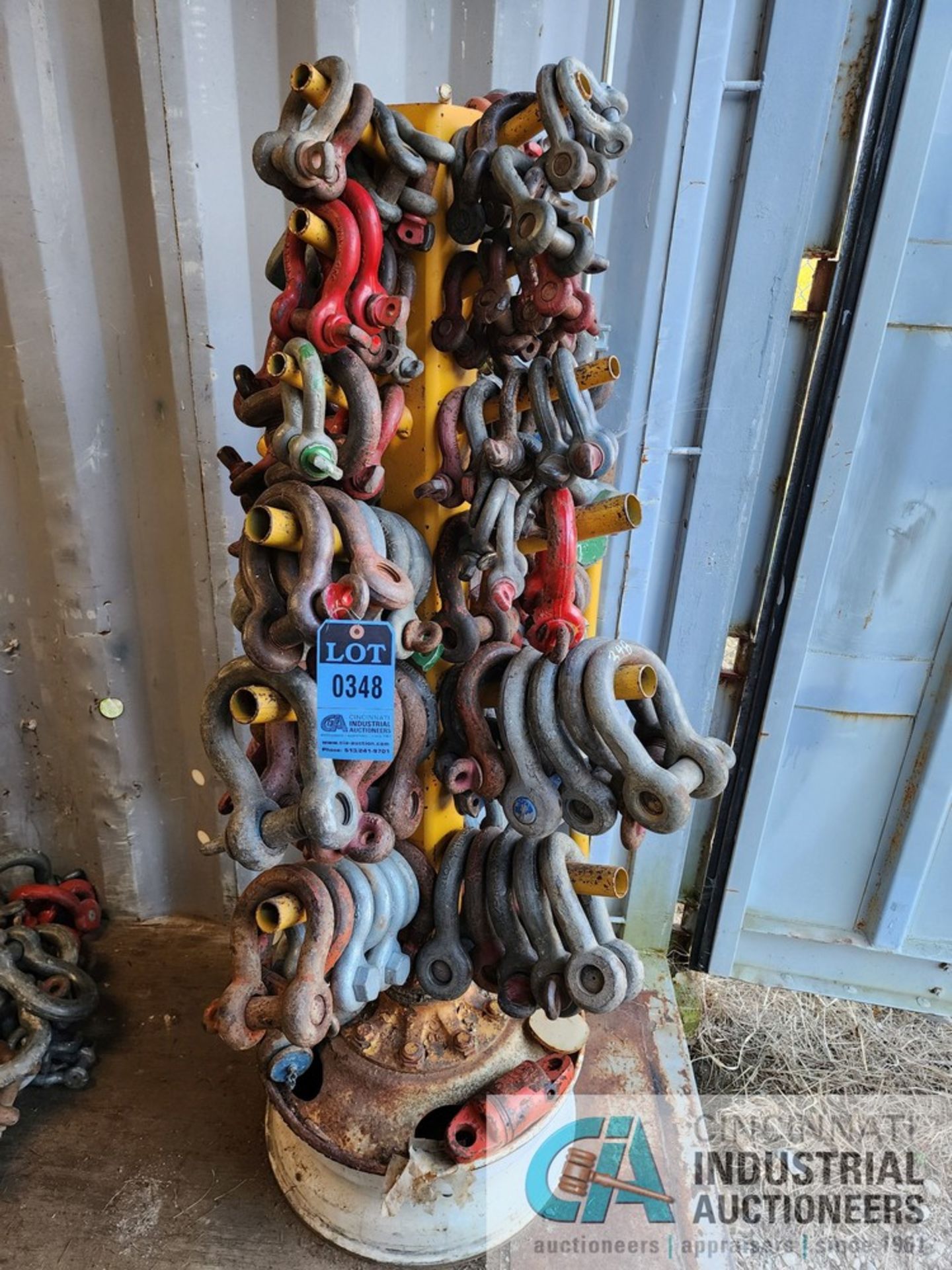 (LOT) SHACKLES ON STORAGE POST