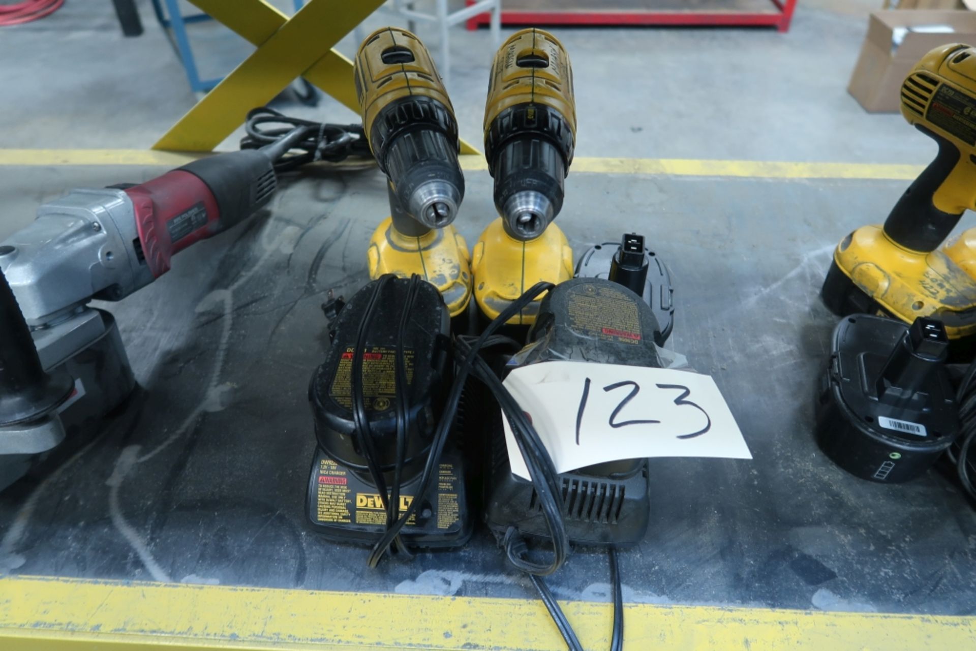LOT OF 2 DEWALT DRILLS WITH 2 CHARGERS AND 3 EXTRA BATTERIES
