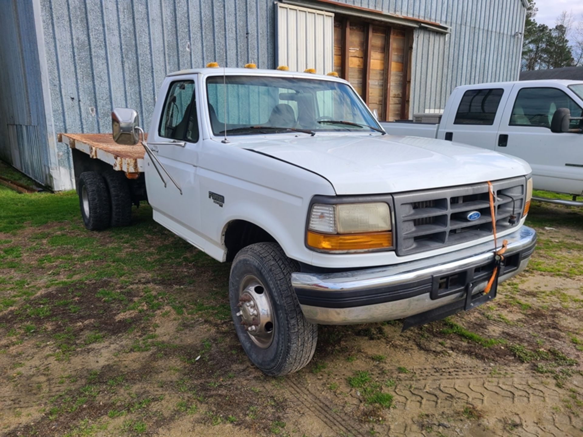 1997 FORD F350 flat bed, 7.3 dsl, auto VIN: 1FDLF47F1VEB79135 - 250,918 miles hood bent