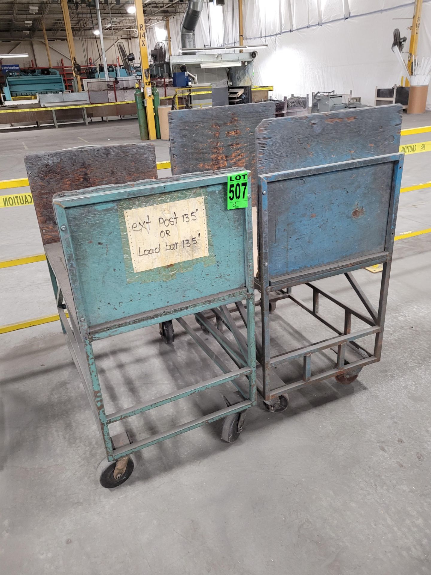 Lot of (2) steel frame carts on casters, w/ wood surface and siding