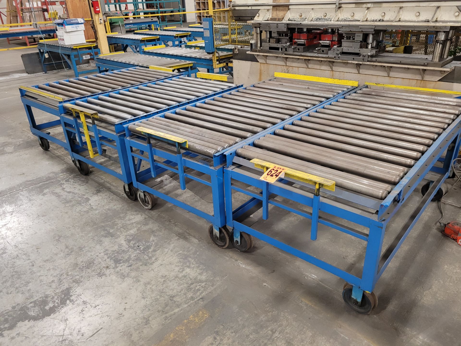 Lot of (4) steel frame manual roller conveyors, ea. w/(2) casters and (2) rail wheels, w/ adjustable