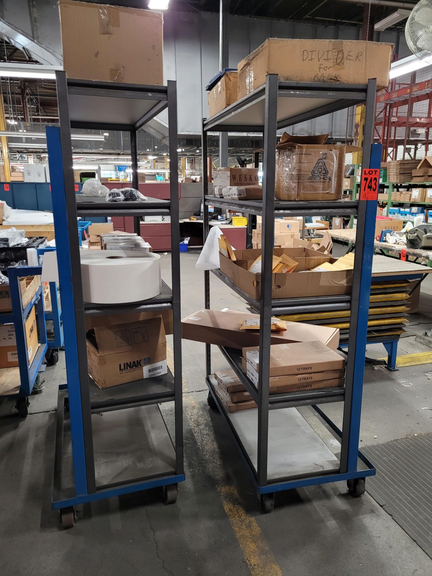 Lot of (2) sections of 5-level steel shelving units on casters