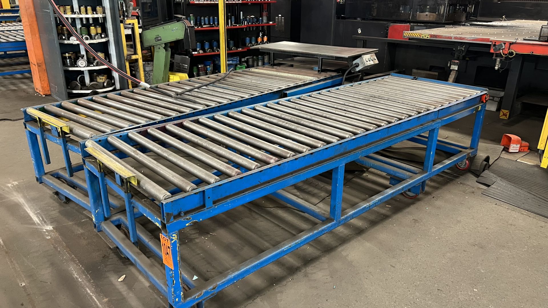 Lot of (2) 10' steel frame manual roller conveyor w/ 2-rail wheels and 4-casters, w/ adjustable bump