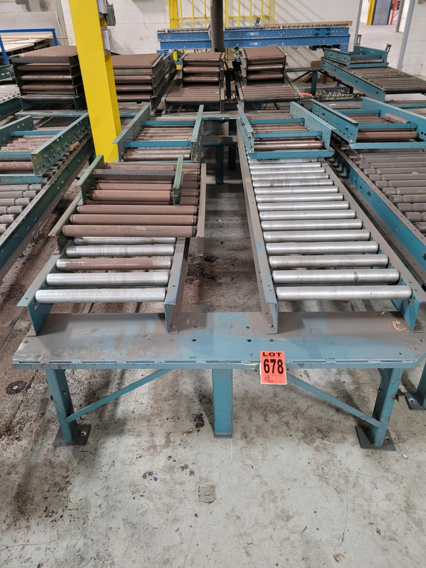 Section of double inclined manual roller conveyor w/ folding extension, 1' space between conveyors