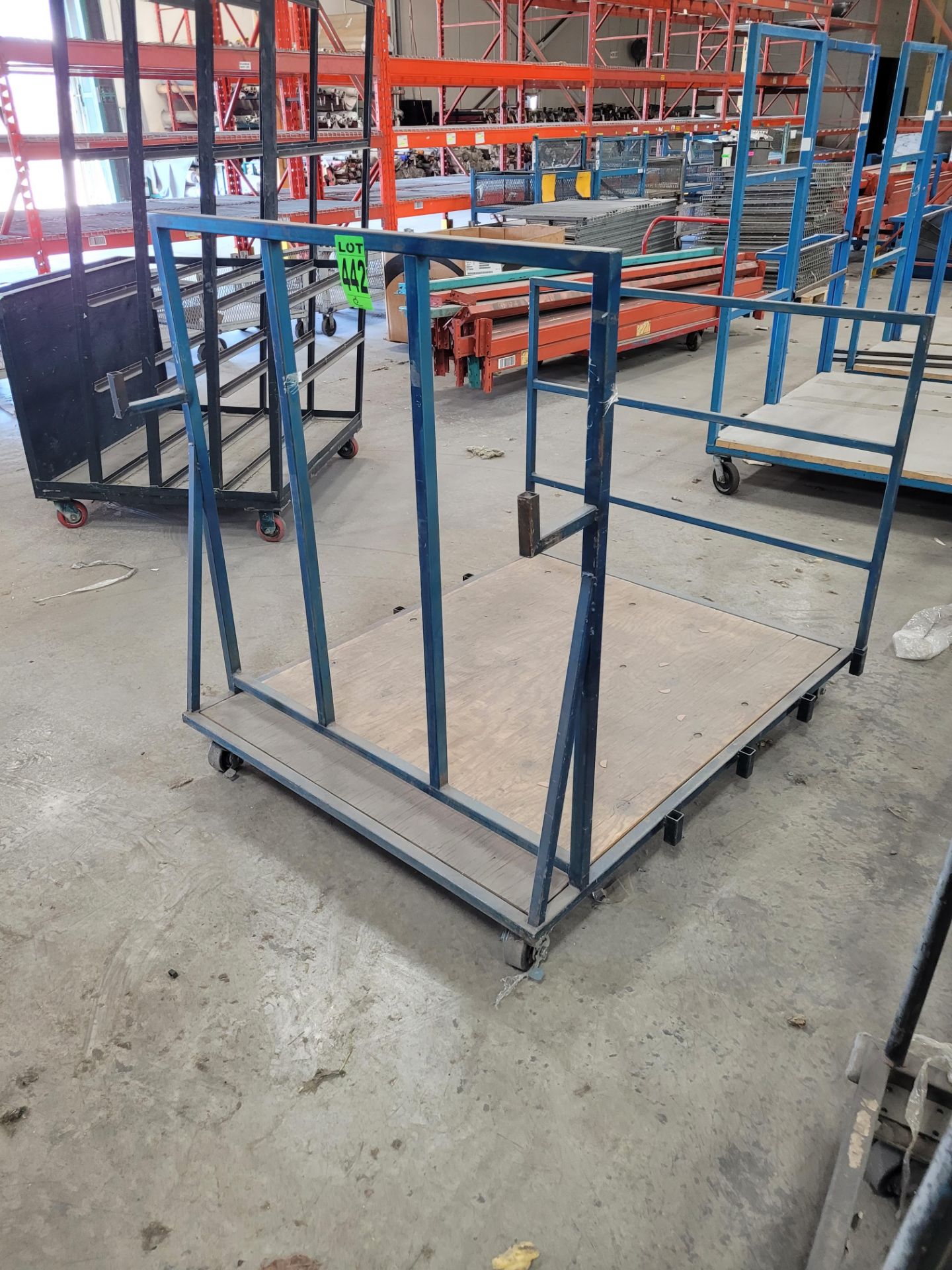 Steel framed transfer cart w/ (2) raised sides on casters, w/ (2) steel hooks, wood base, 4' x 5' x