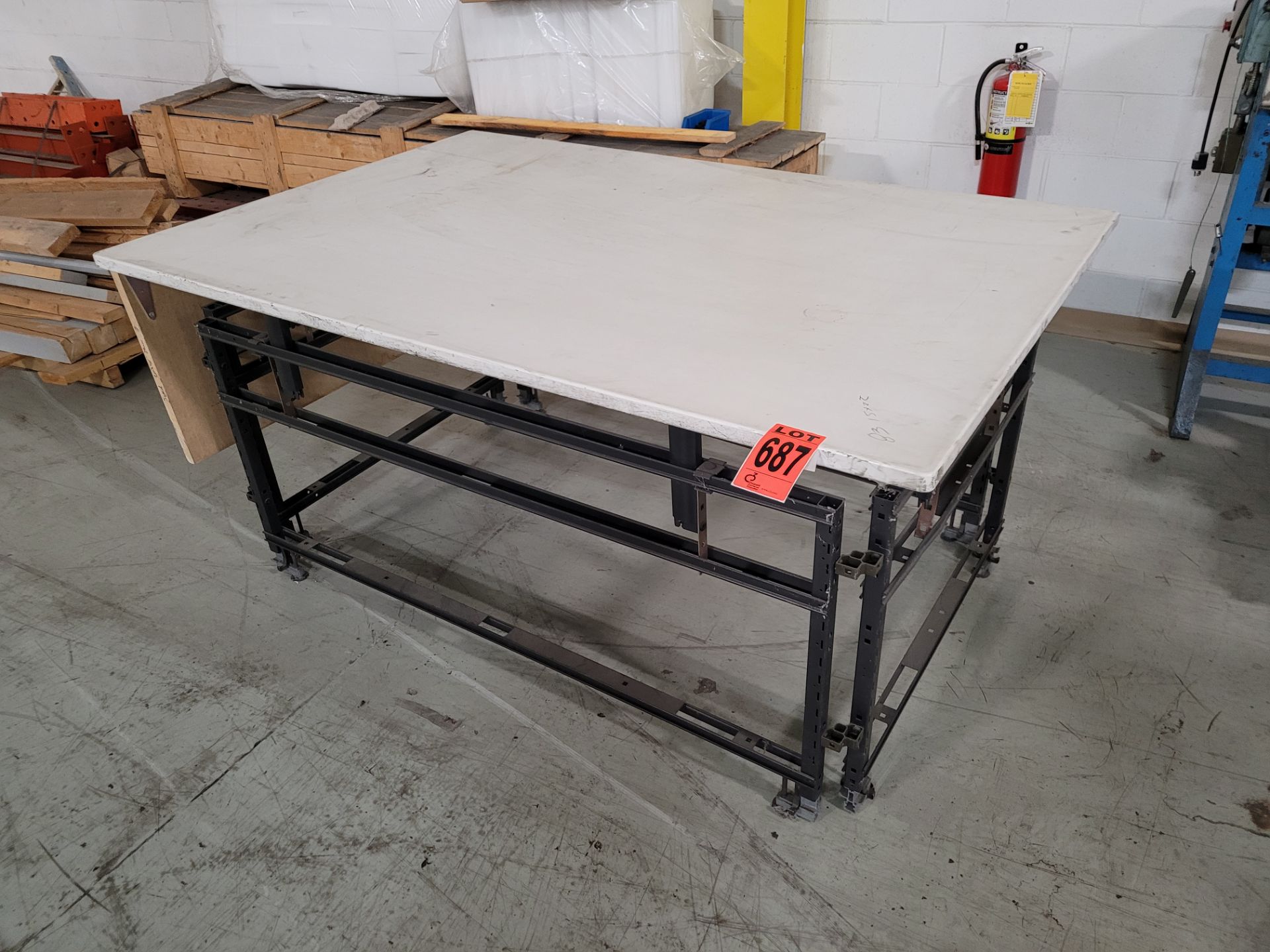 Steel frame worktable w/ composite surface, plywood extension piece