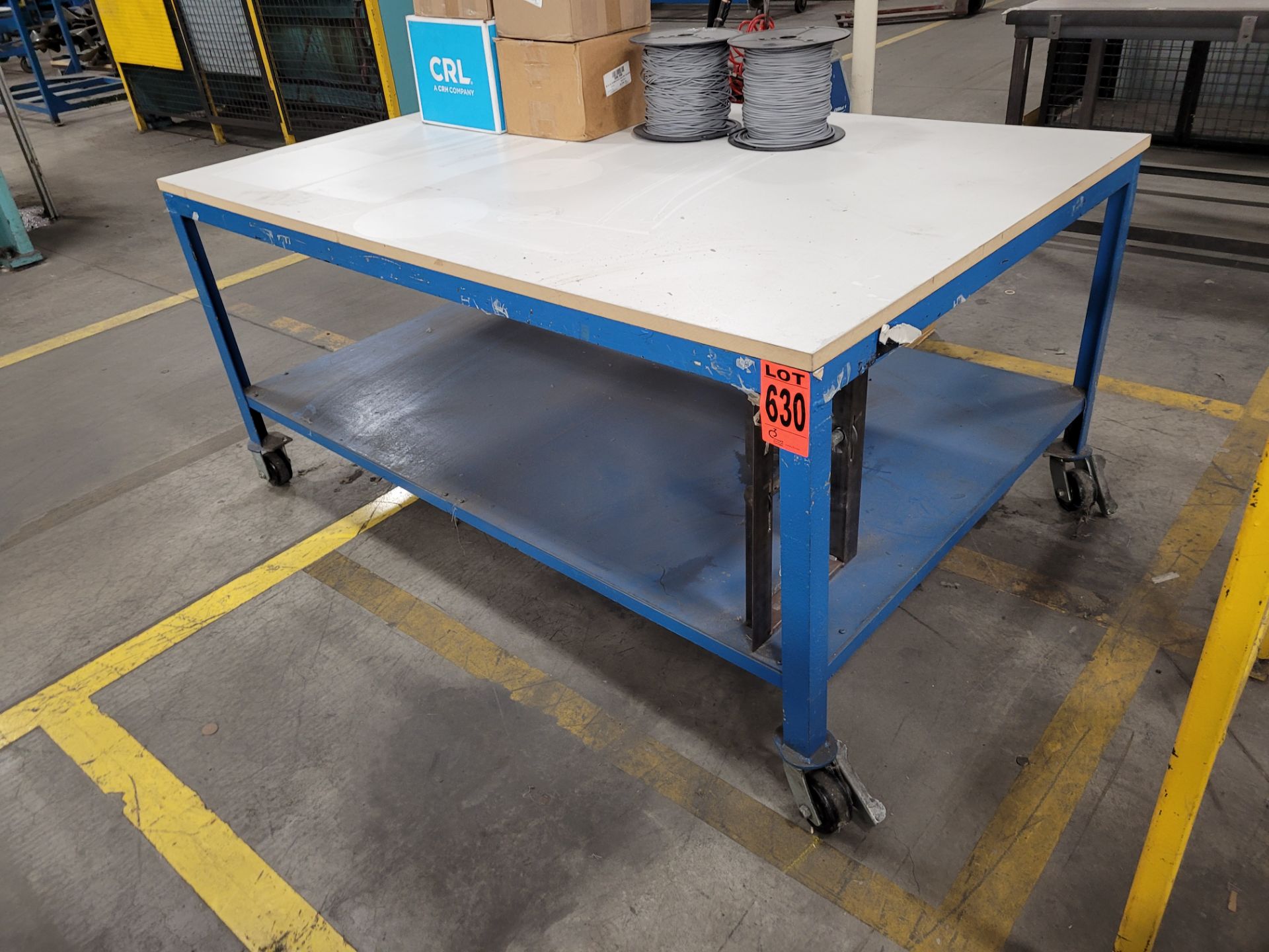 Mobile steel frame worktable on lockable casters w/plywood surface (no contents) - Image 2 of 3