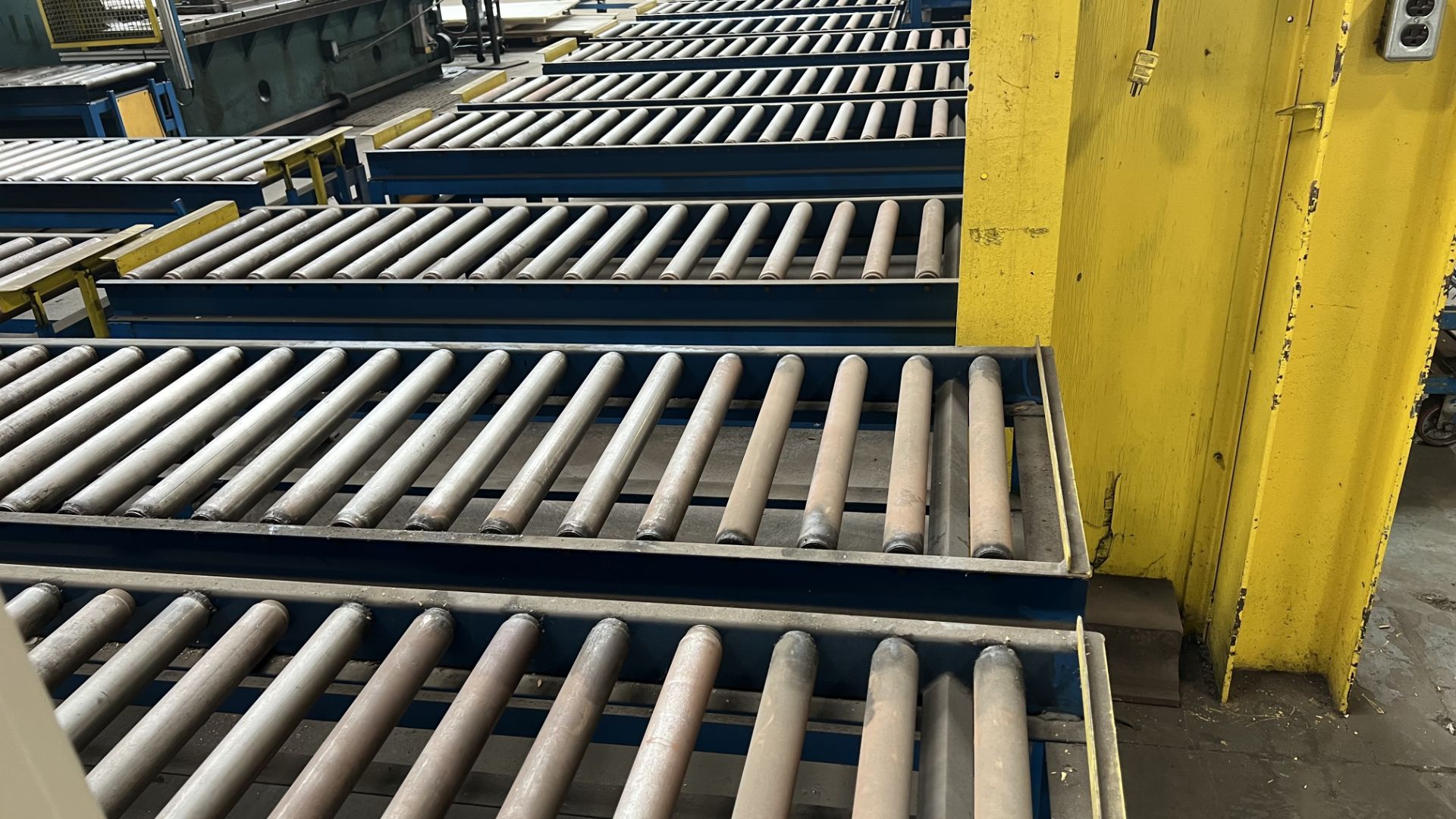 Lot of (9) steel frame fixed manual roller conveyor sections w/ adj/ bumper bars