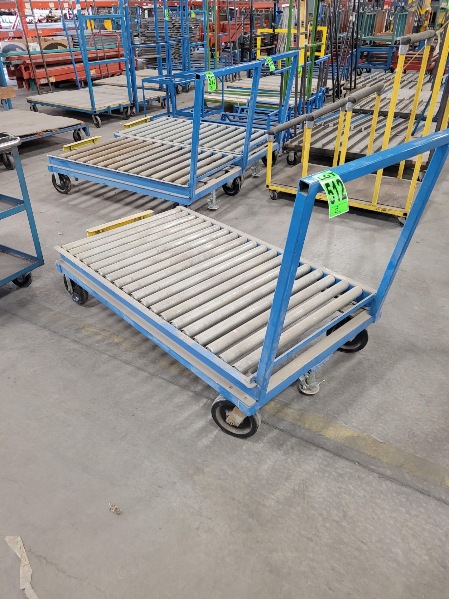 Heavy-duty steel roller conveyor on casters, w/ floor lock, handle, adjustable height backstop