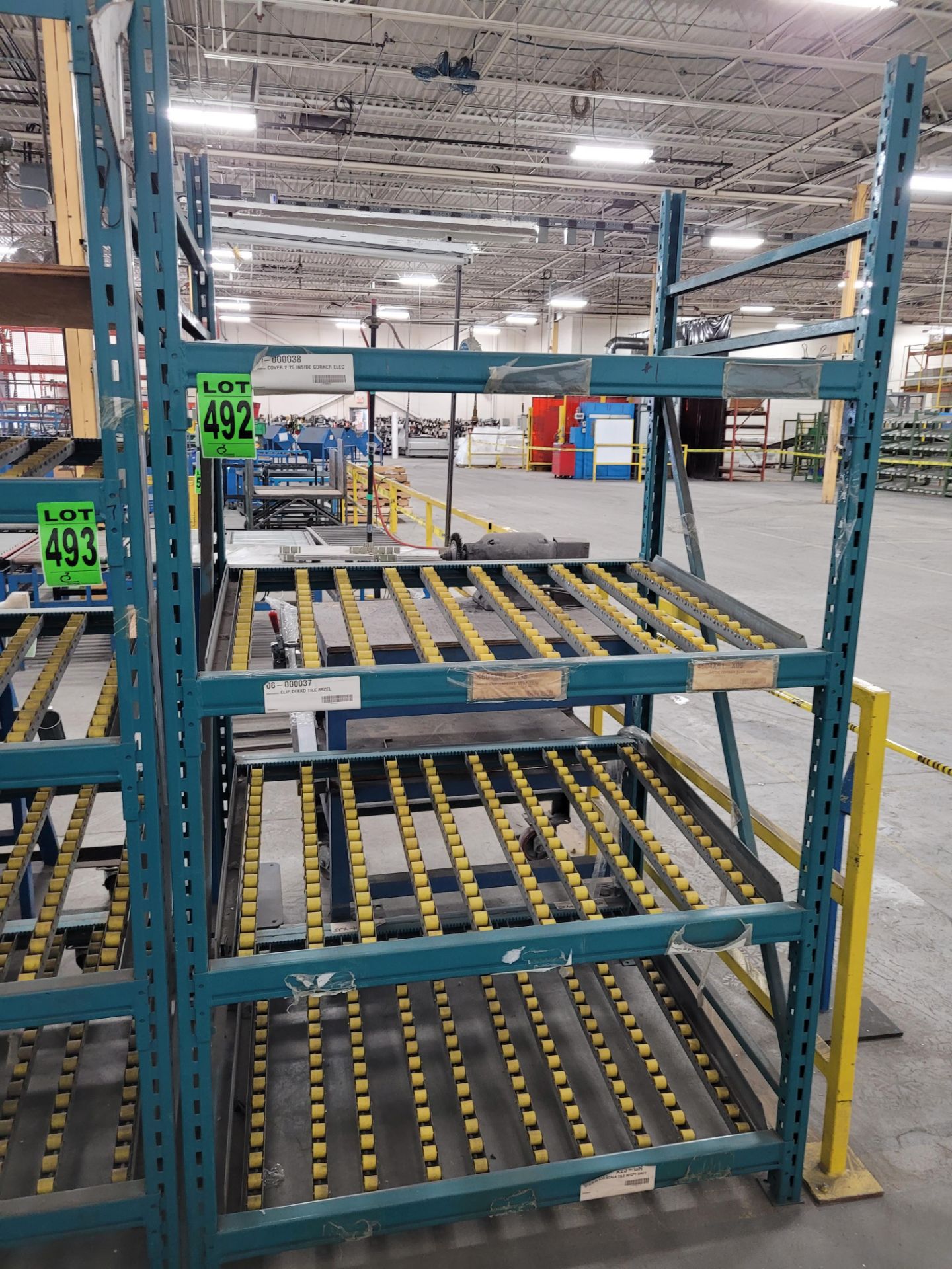 Section of 4-level steel racking w/ inclined roller shelves