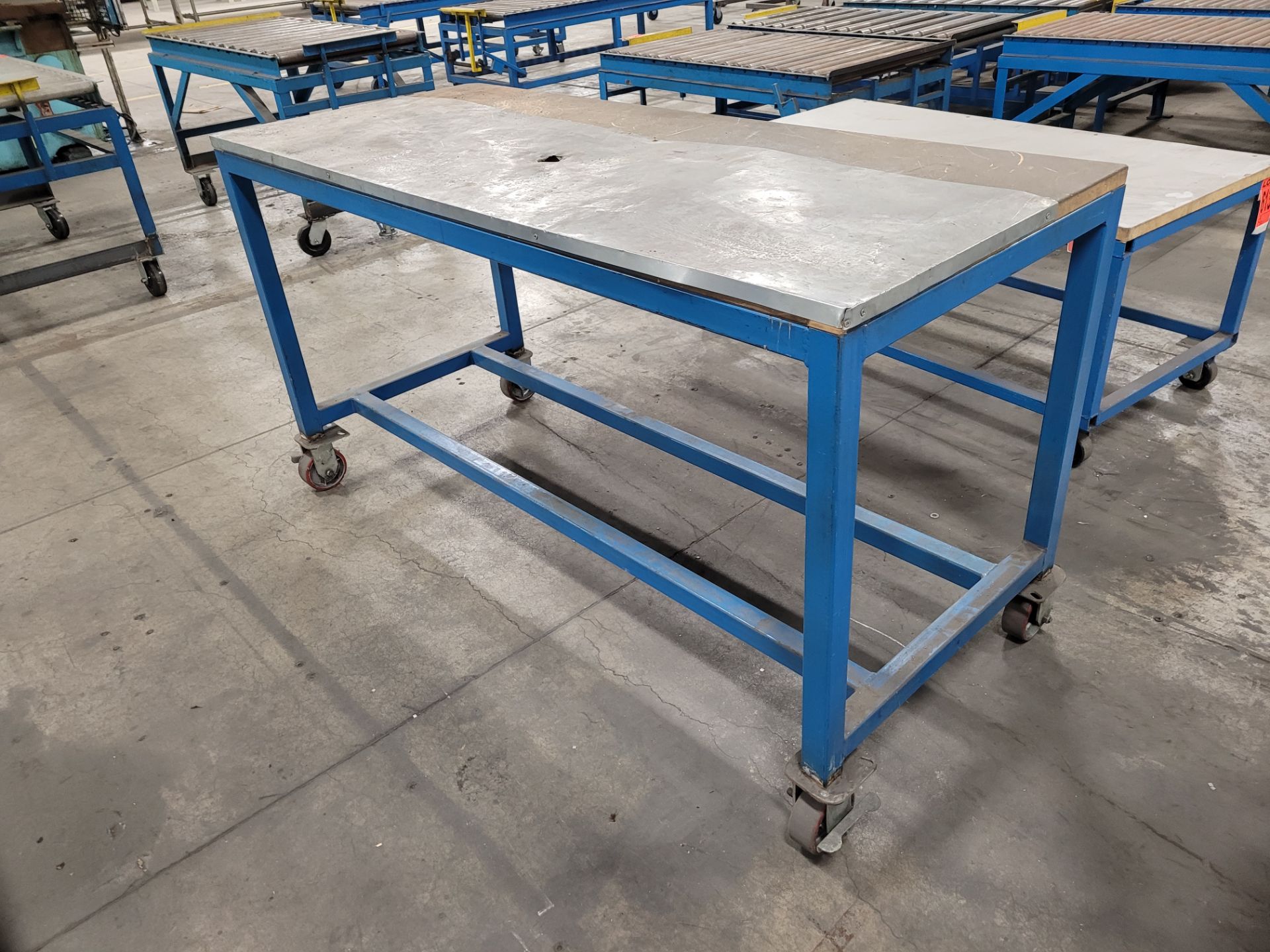 Mobile steel frame worktable on lockable casters w/plywood surface - Image 2 of 2