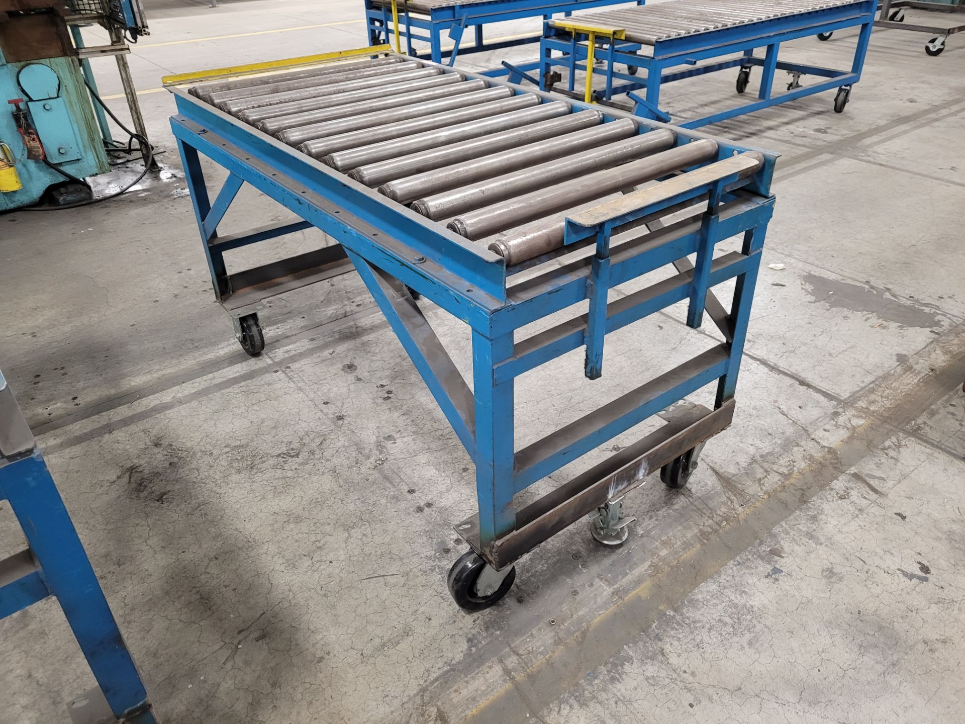 Mobile roller conveyor on casters w/floor lock and (2) adjustable steel backstops - Image 5 of 5