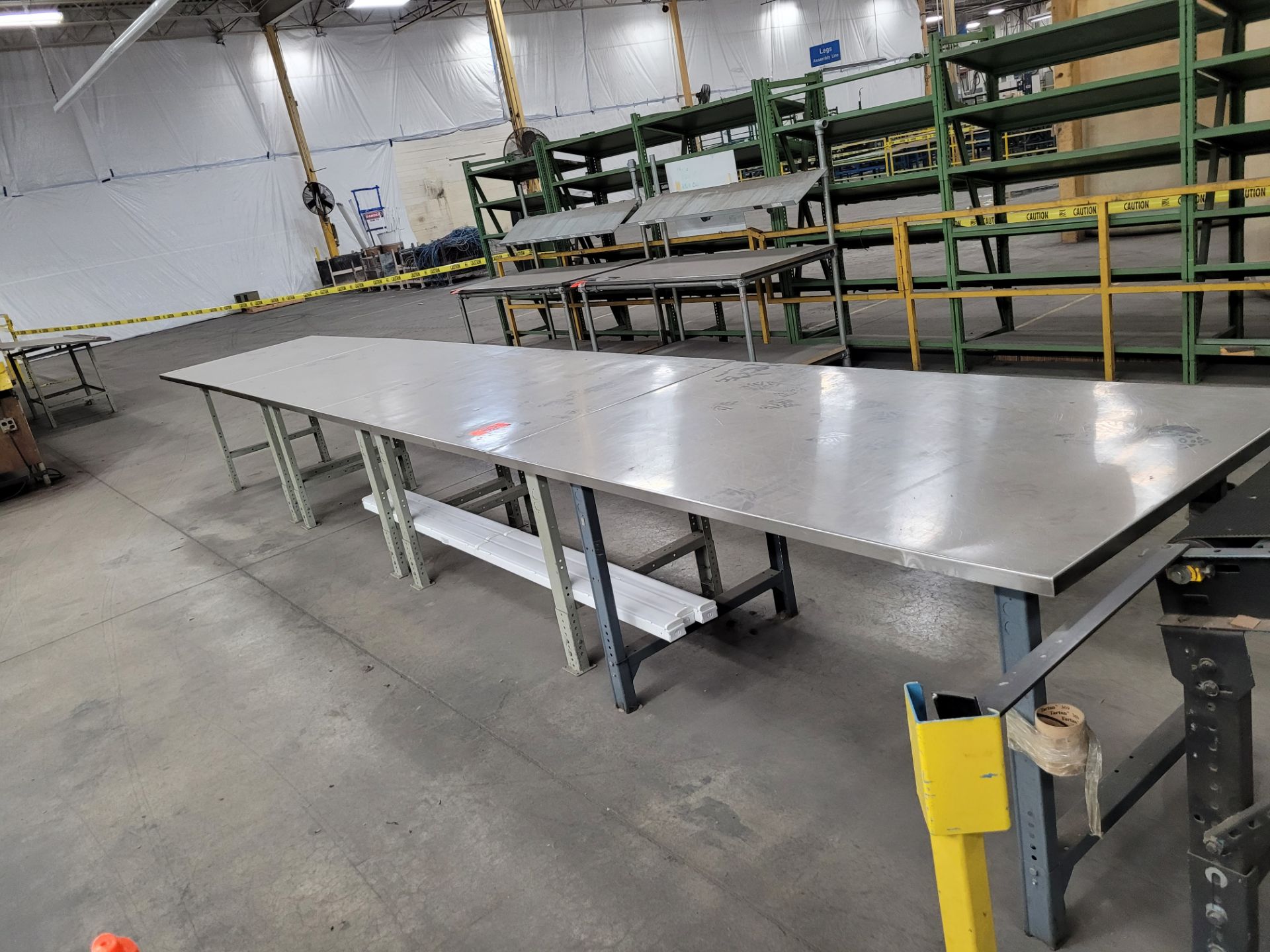 Lot of (3) stainless steel worktables, bolted together, metal bases