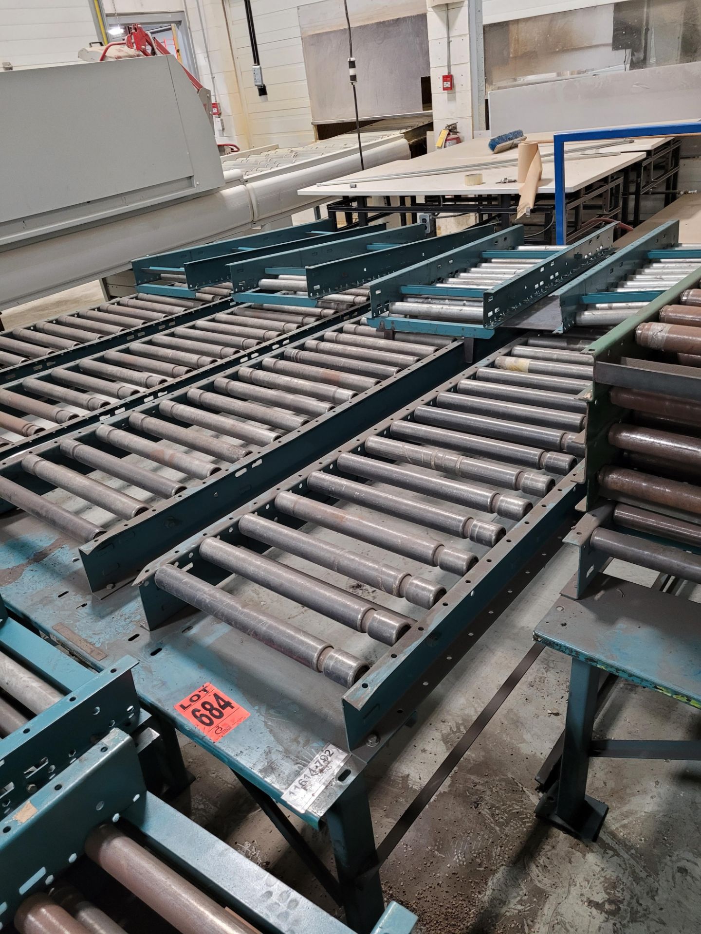 Section of double inclined manual roller conveyor w/ folding extension, 1' space between conveyors