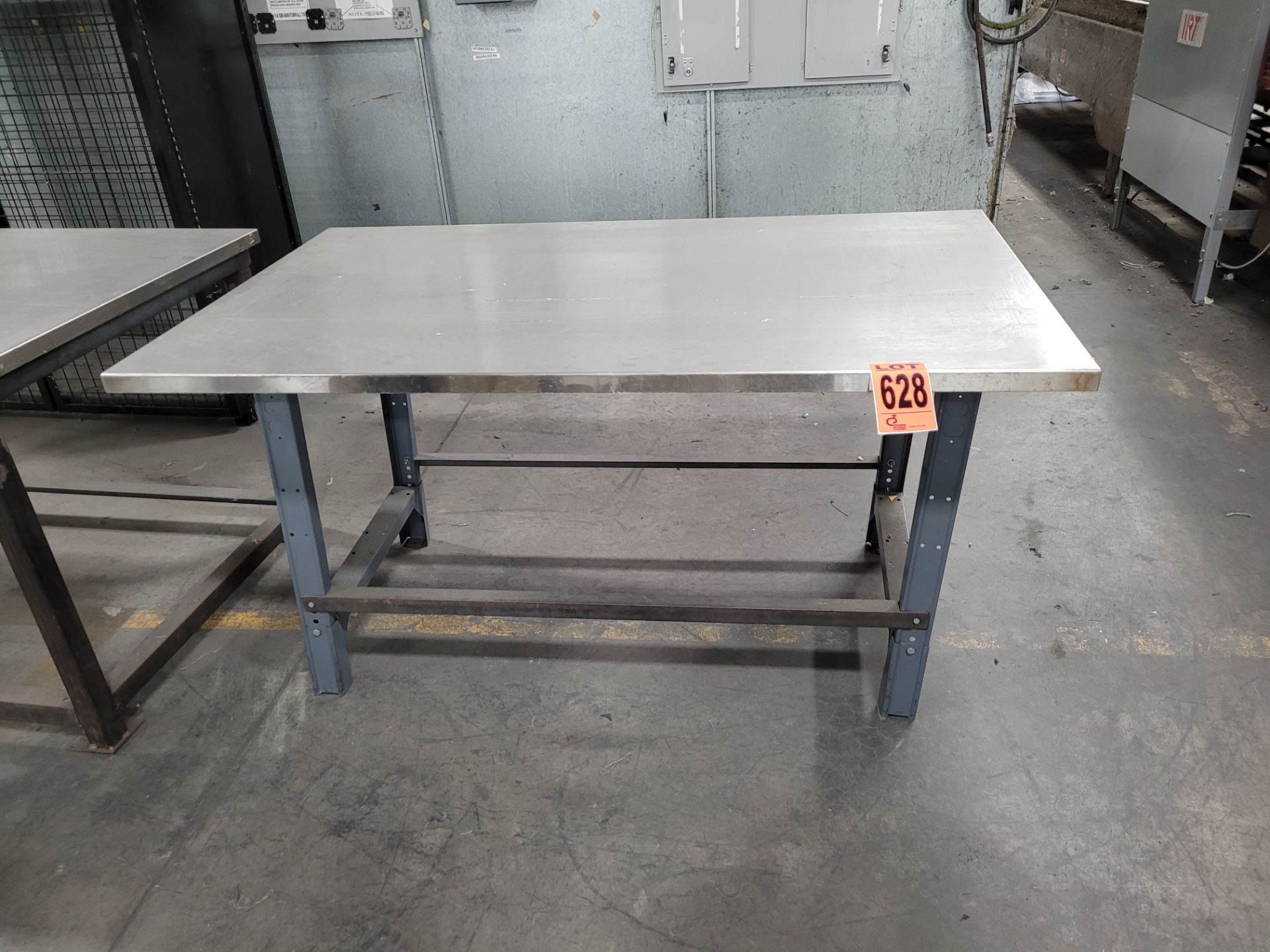 Stainless steel worktable on metal base