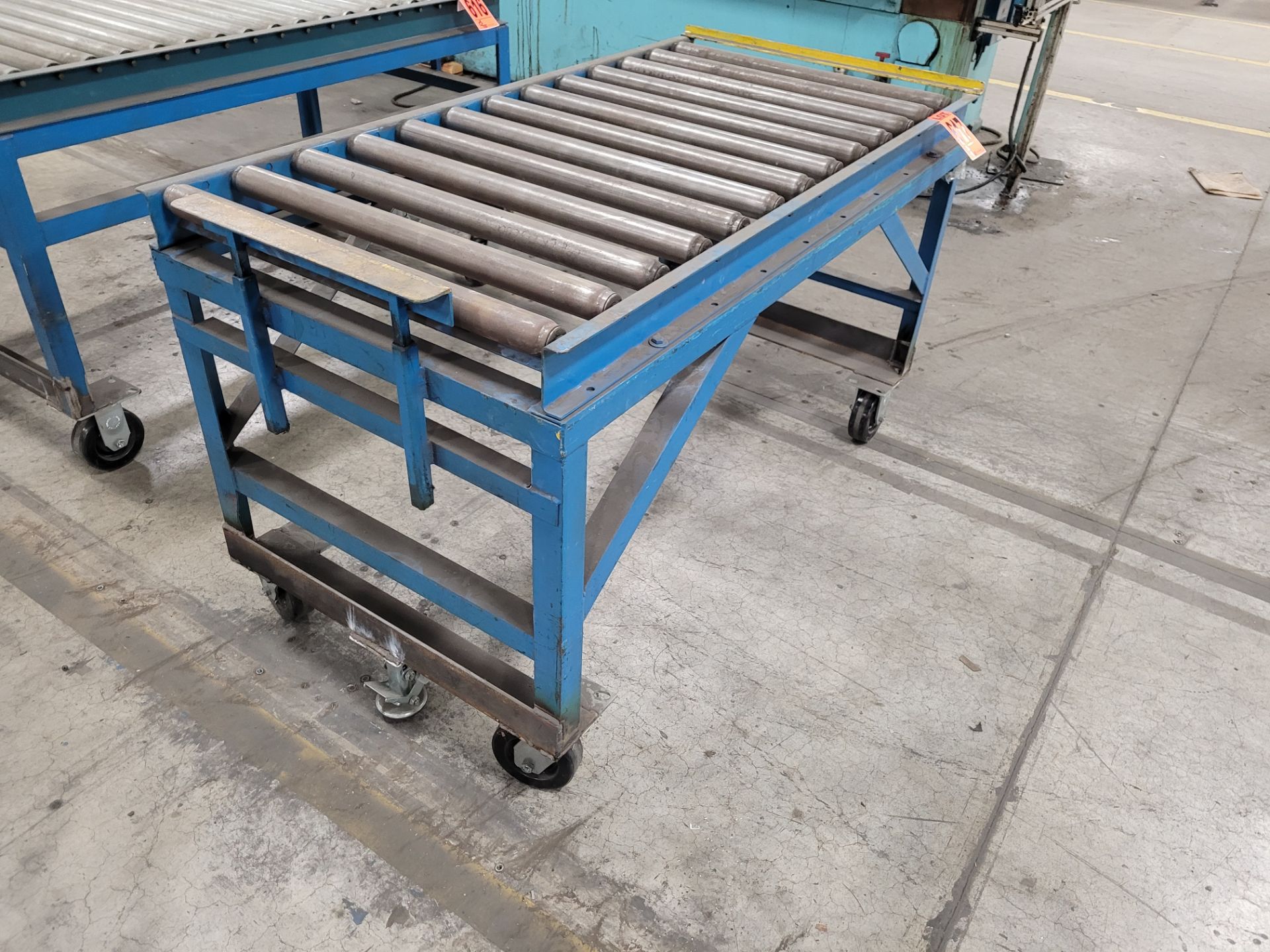 Mobile roller conveyor on casters w/floor lock and (2) adjustable steel backstops - Image 3 of 5