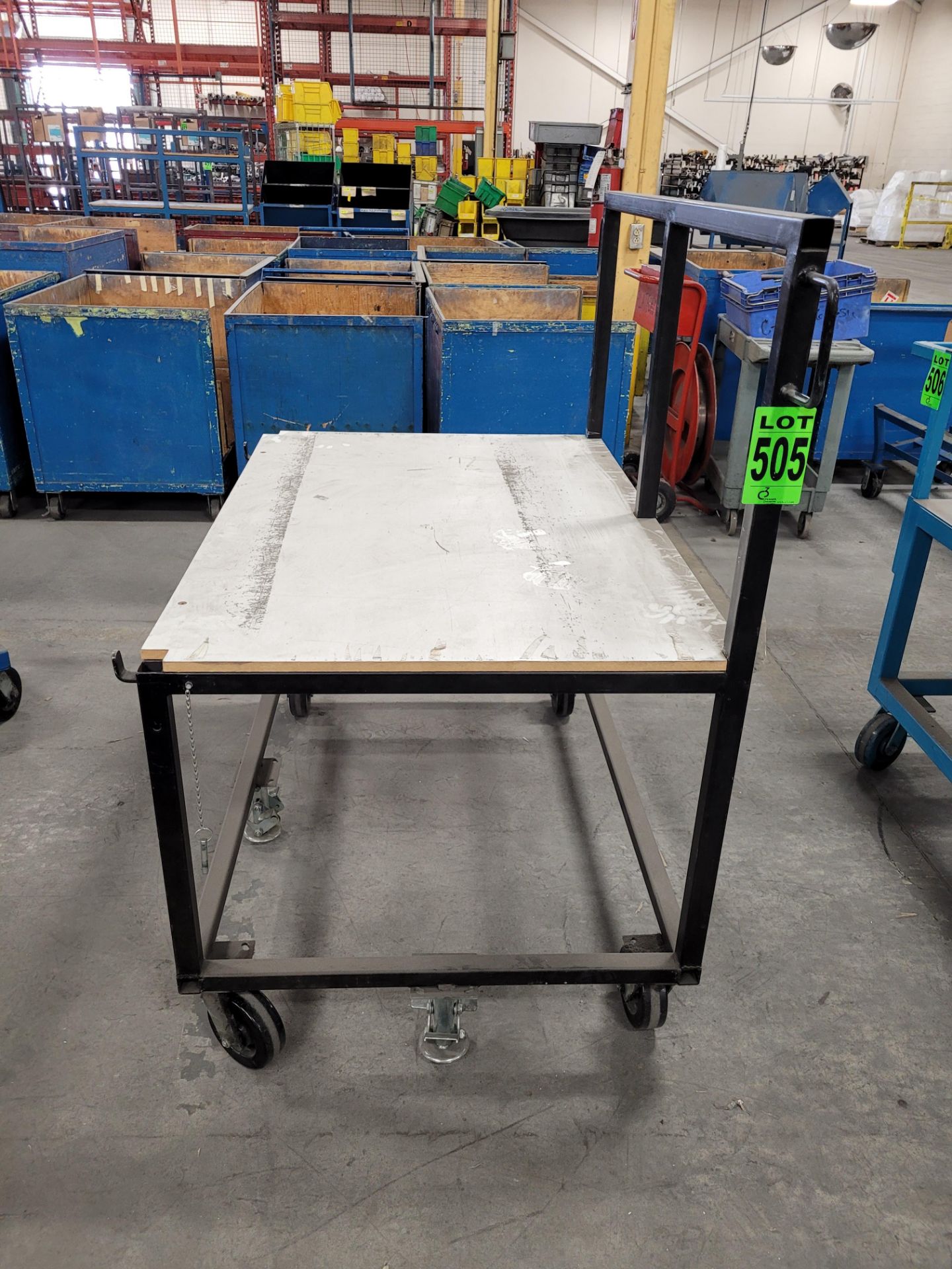Mobile steel frame worktable with handle, on casters, w/ floor locks, plywood surface - Image 2 of 3