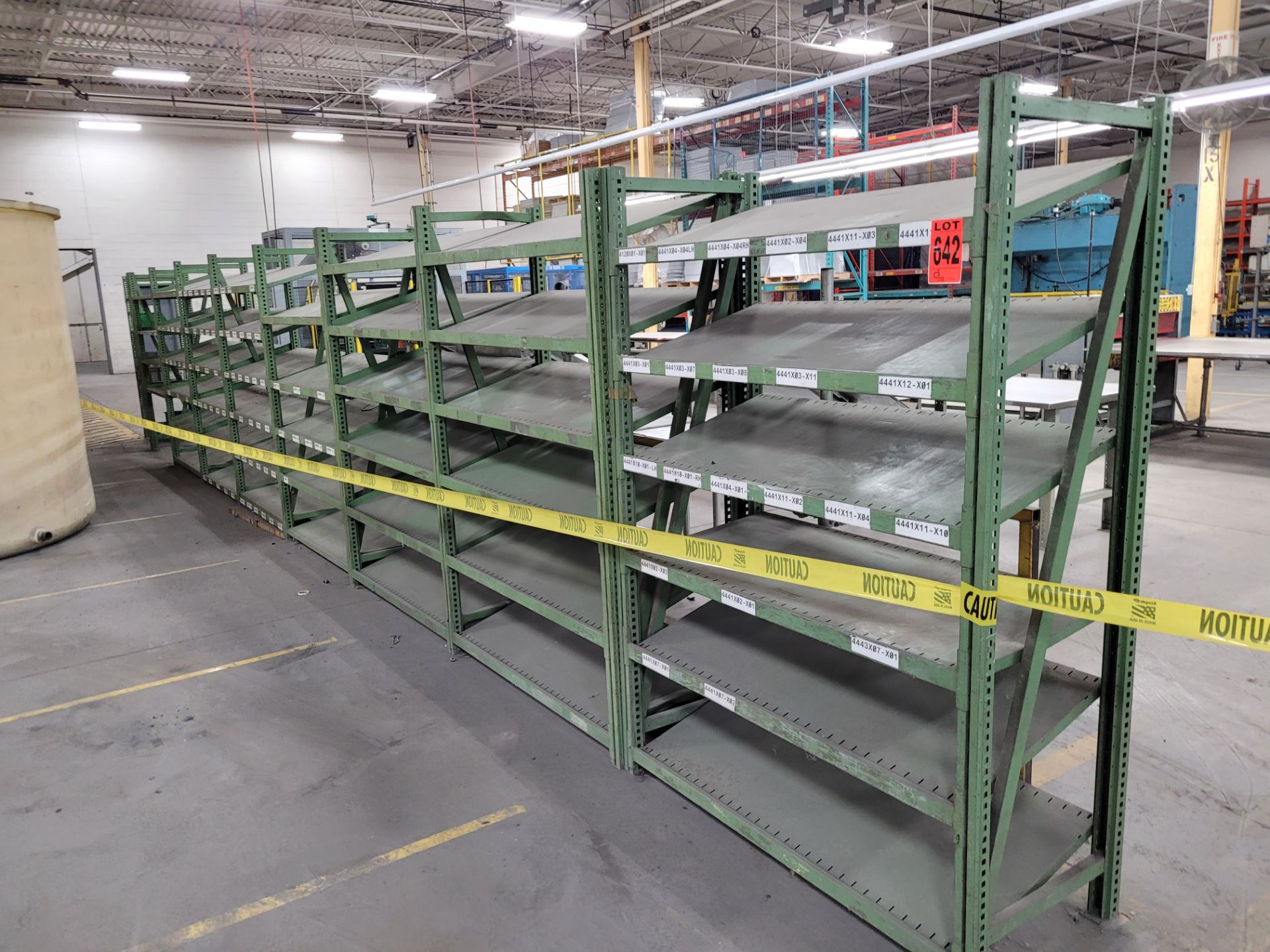 Lot of (8) sections of 6-level inclined teardrop shelving units, (45) shelves, (16) uprights