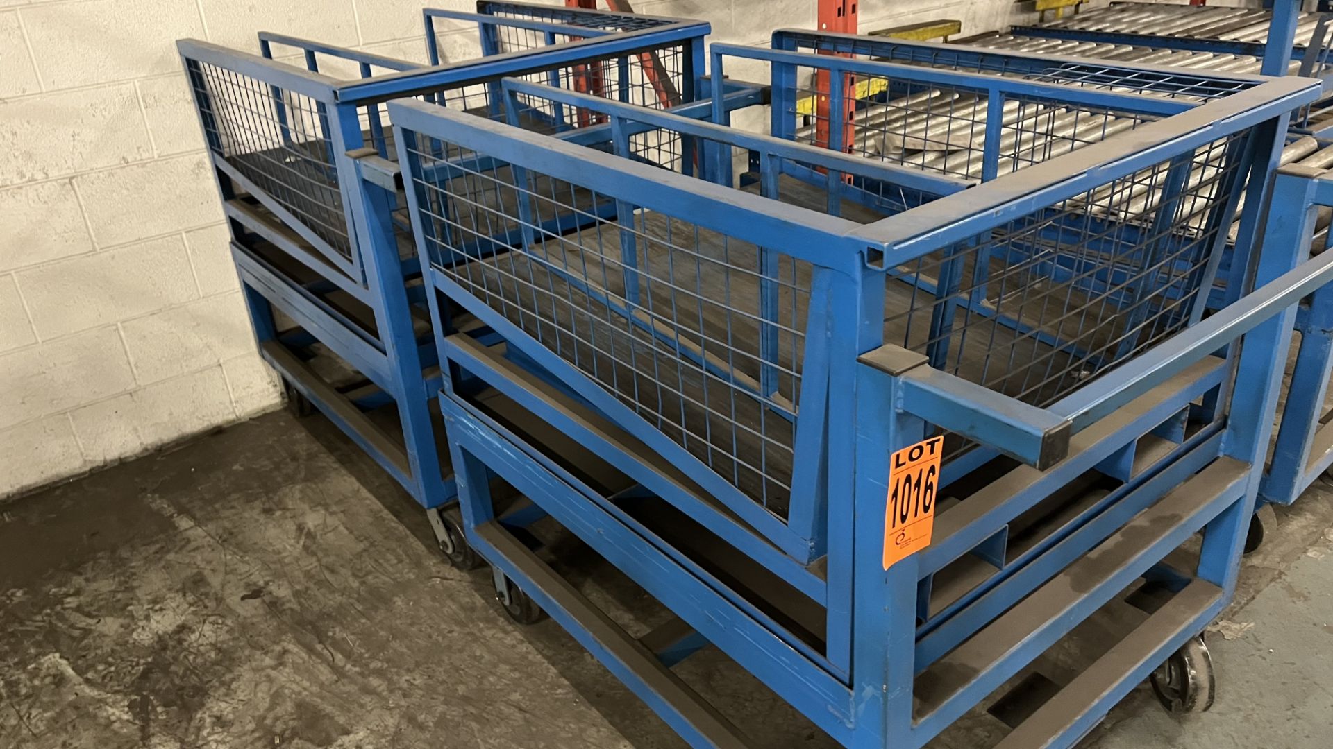 Lot of (2) steel frame heavy-duty platform carts on casters and contents incl. (2) steel frame wire