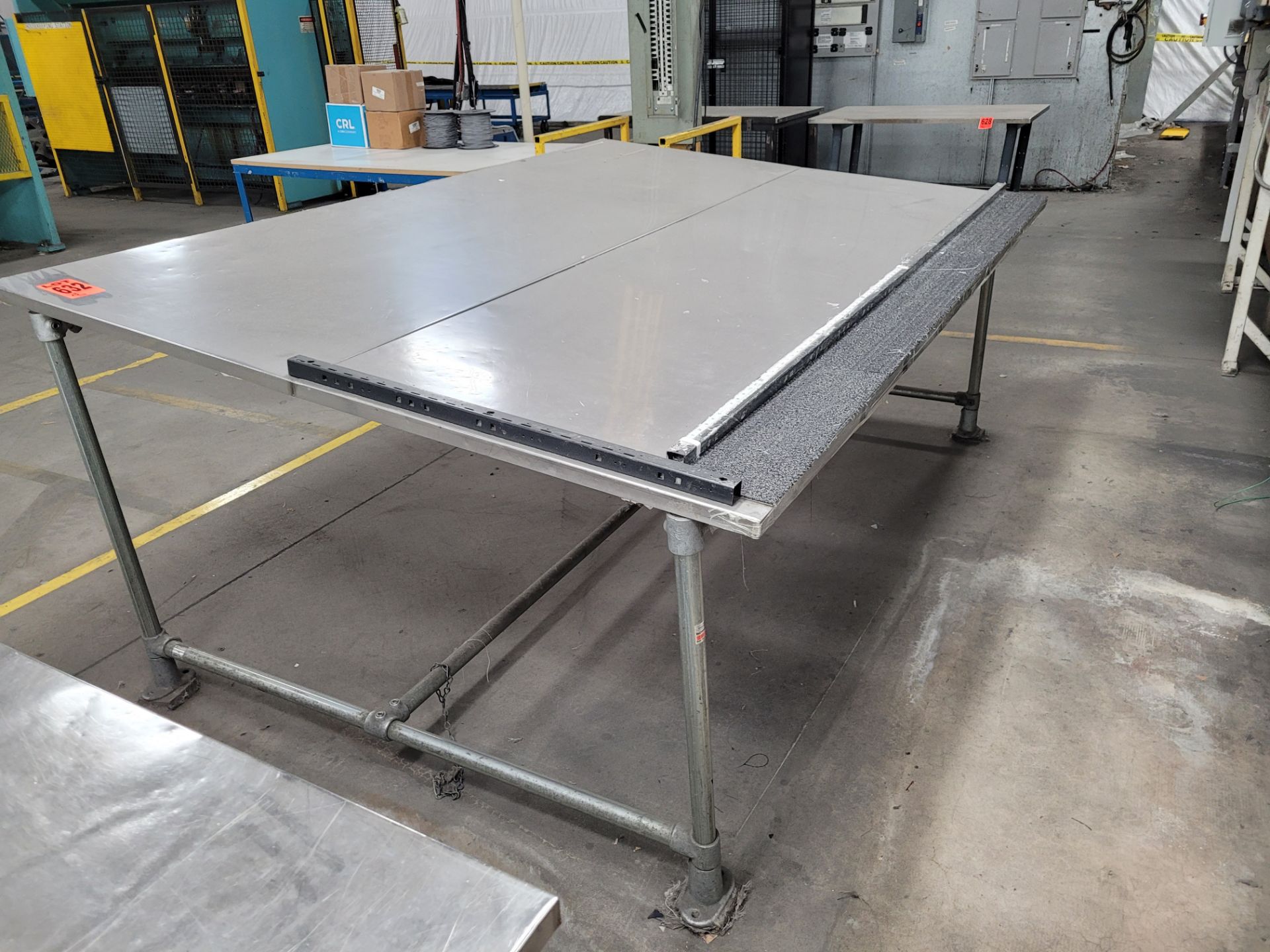 Inclined worktable w/ ss-sheet surface on plywood, w/ galvanized steel base