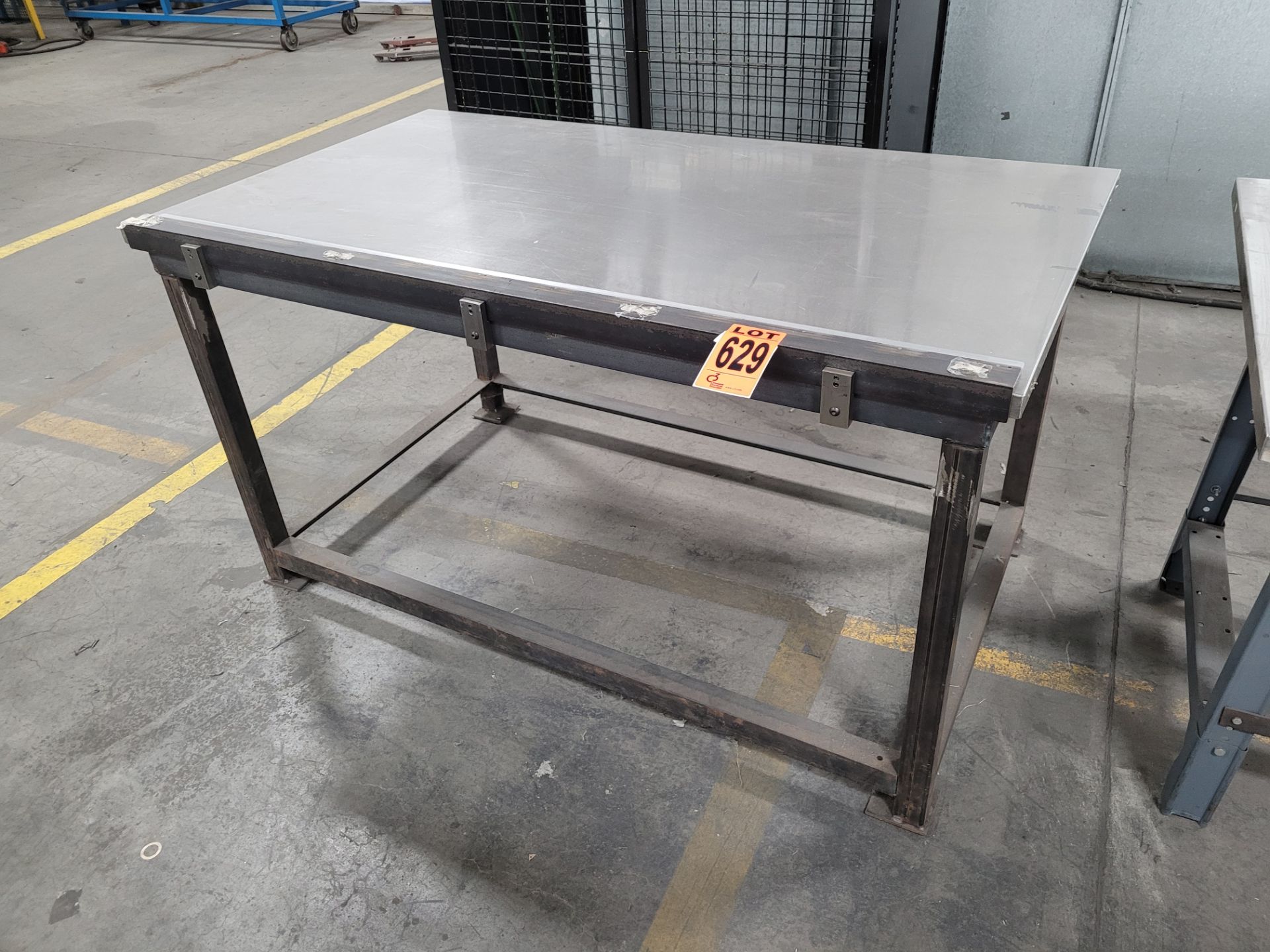 Stainless steel worktable on metal base