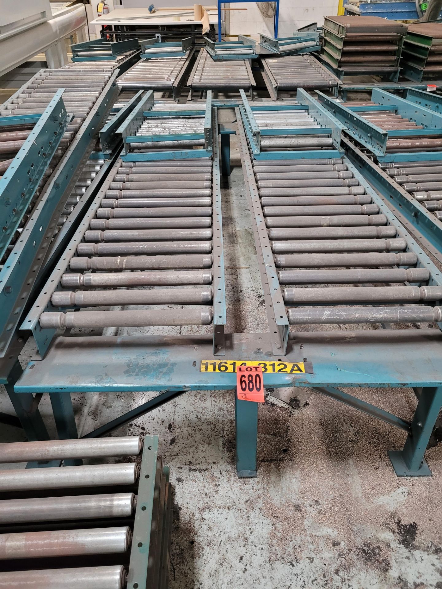 Section of double inclined manual roller conveyor w/ folding extension, 1' space between conveyors