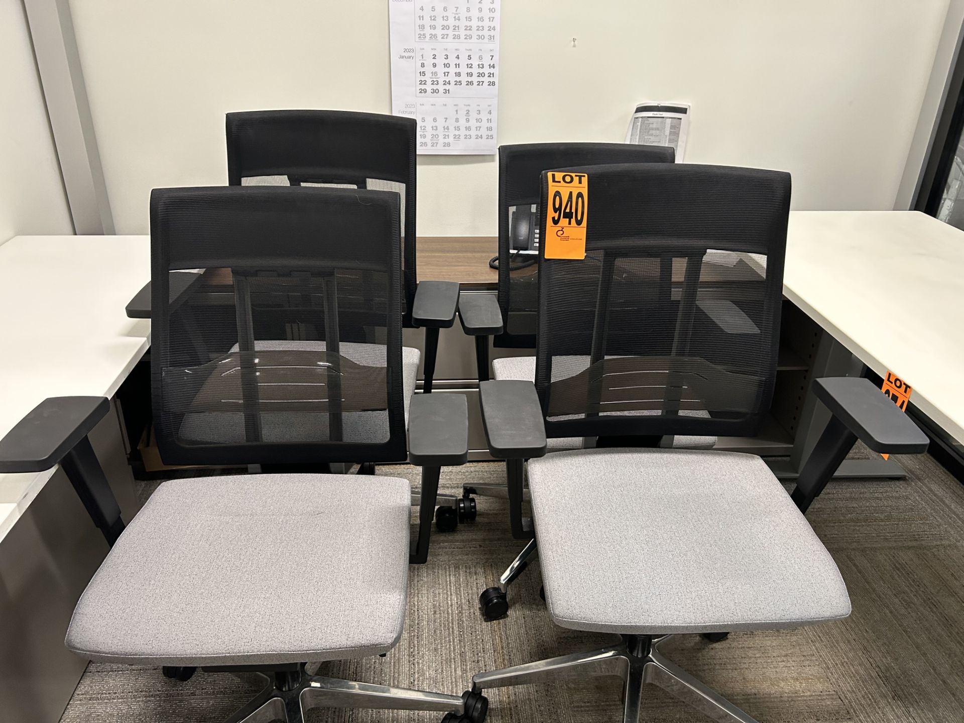 Lot of (4) adjustable executive mesh-back rolling office chairs