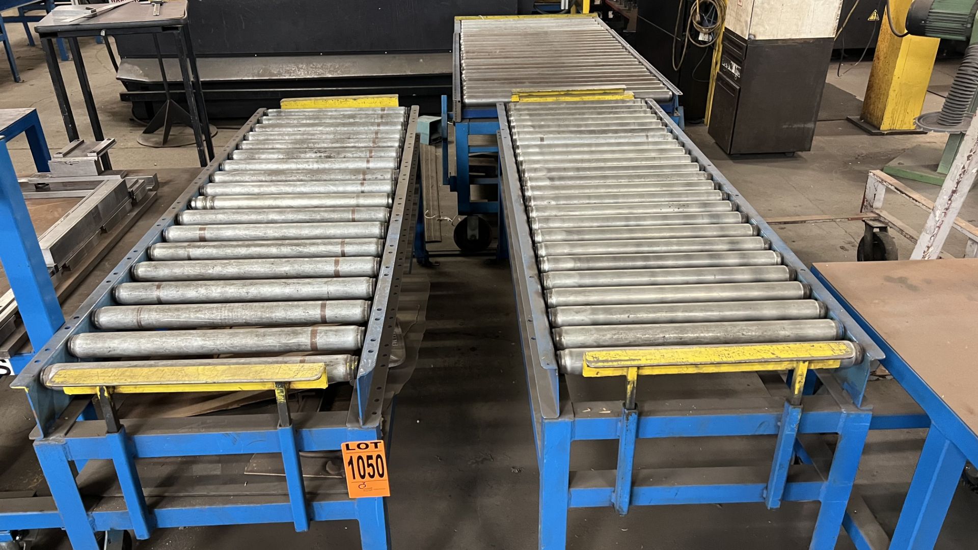 Lot of (3) manual roller conveyors, (2) fixed steel frame units w/ adjustable bumper bars, (1) w/ ra