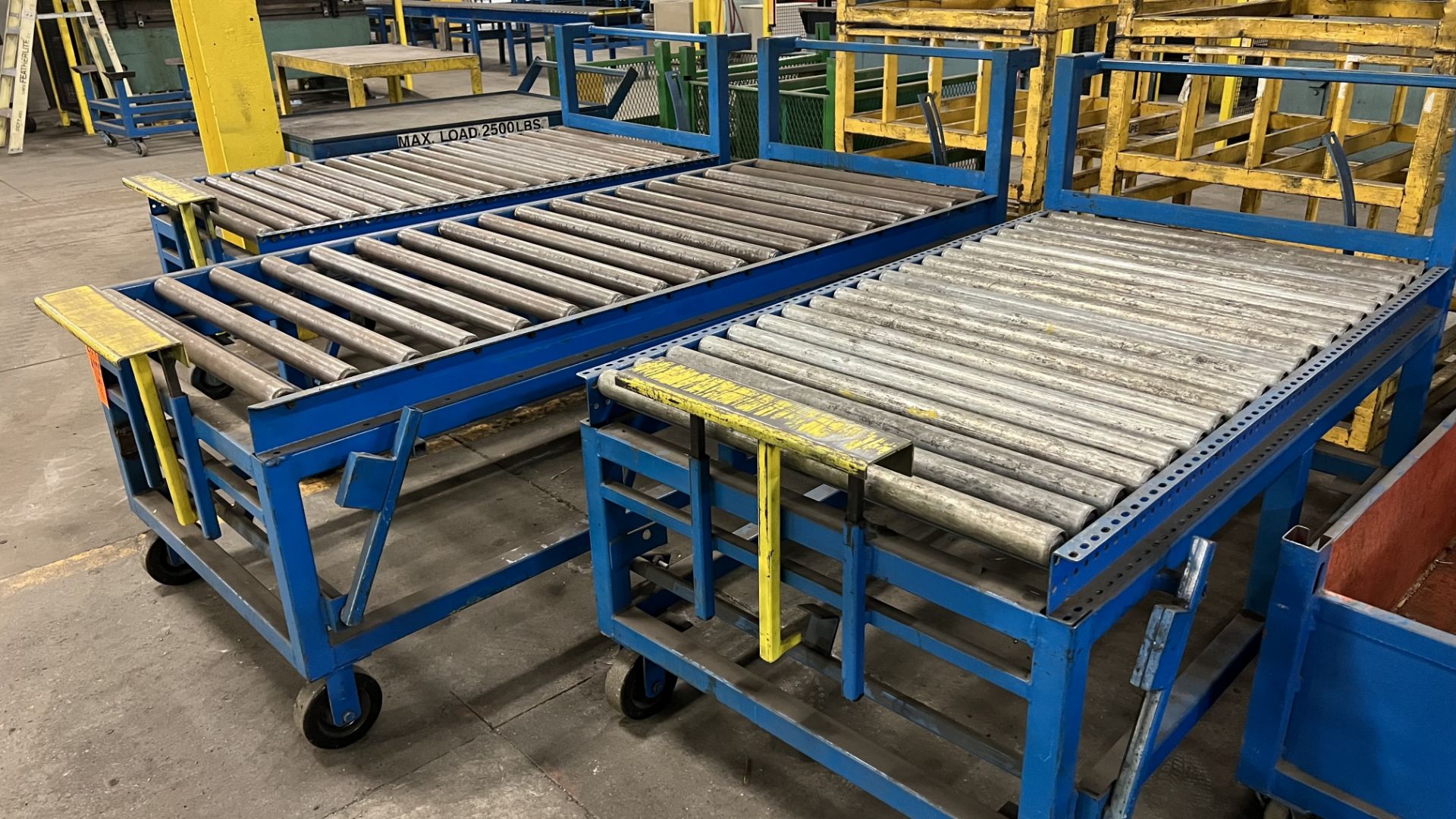 Lot of (3) mobile roller conveyors on casters w/ foot lock, adjustable bumper bars, handles - Image 2 of 2