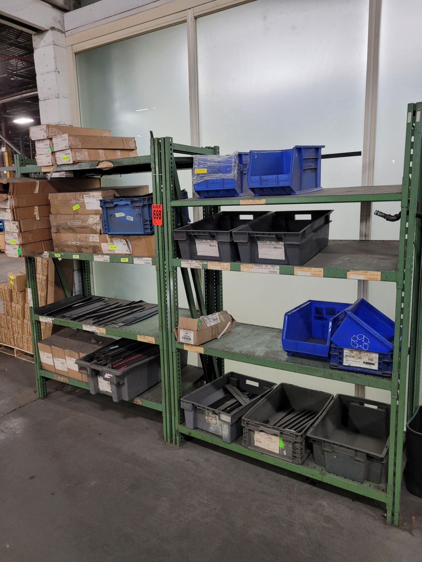 Lot of (2) sections of 6-level inclined teardrop shelving units, (8) shelves, (4) uprights