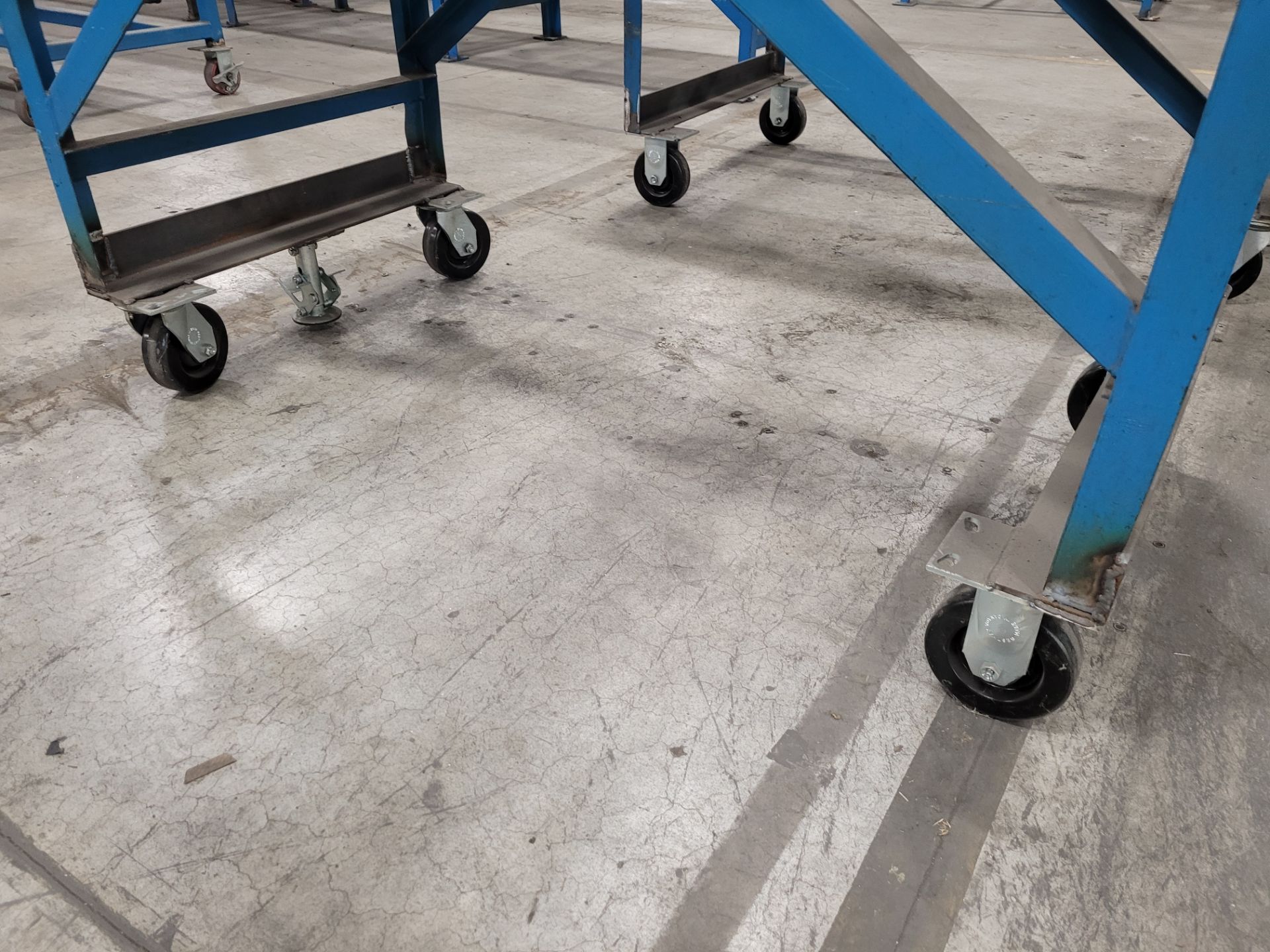 Mobile roller conveyor on casters w/floor lock and (2) adjustable steel backstops - Image 2 of 5