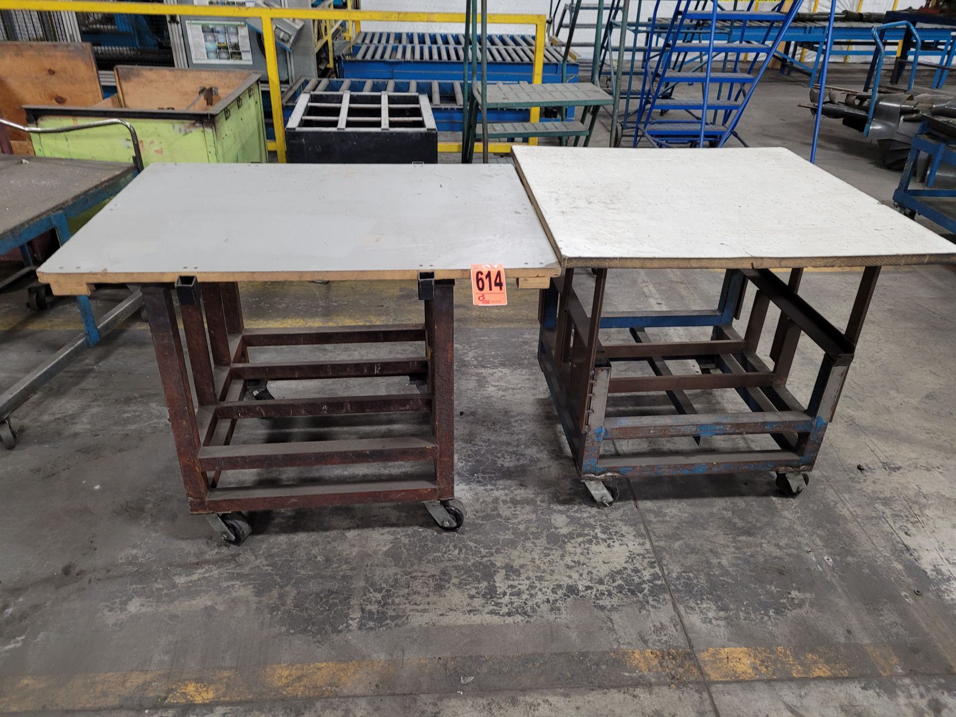 Lot of (2) steel frame, plywood surface mobile workstations on casters