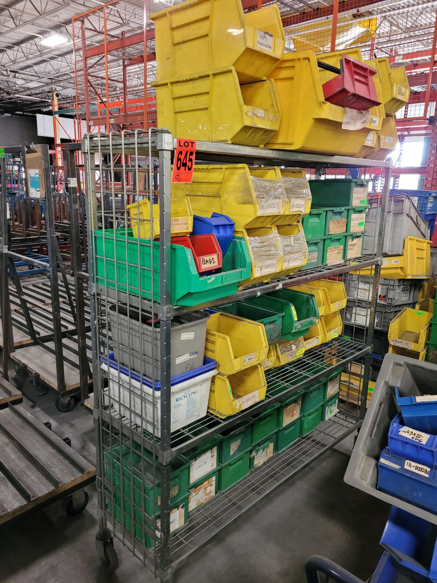 Lot of steel 4-level adjustable wire shelving unit on casters and contents incl. (48) crates, totes