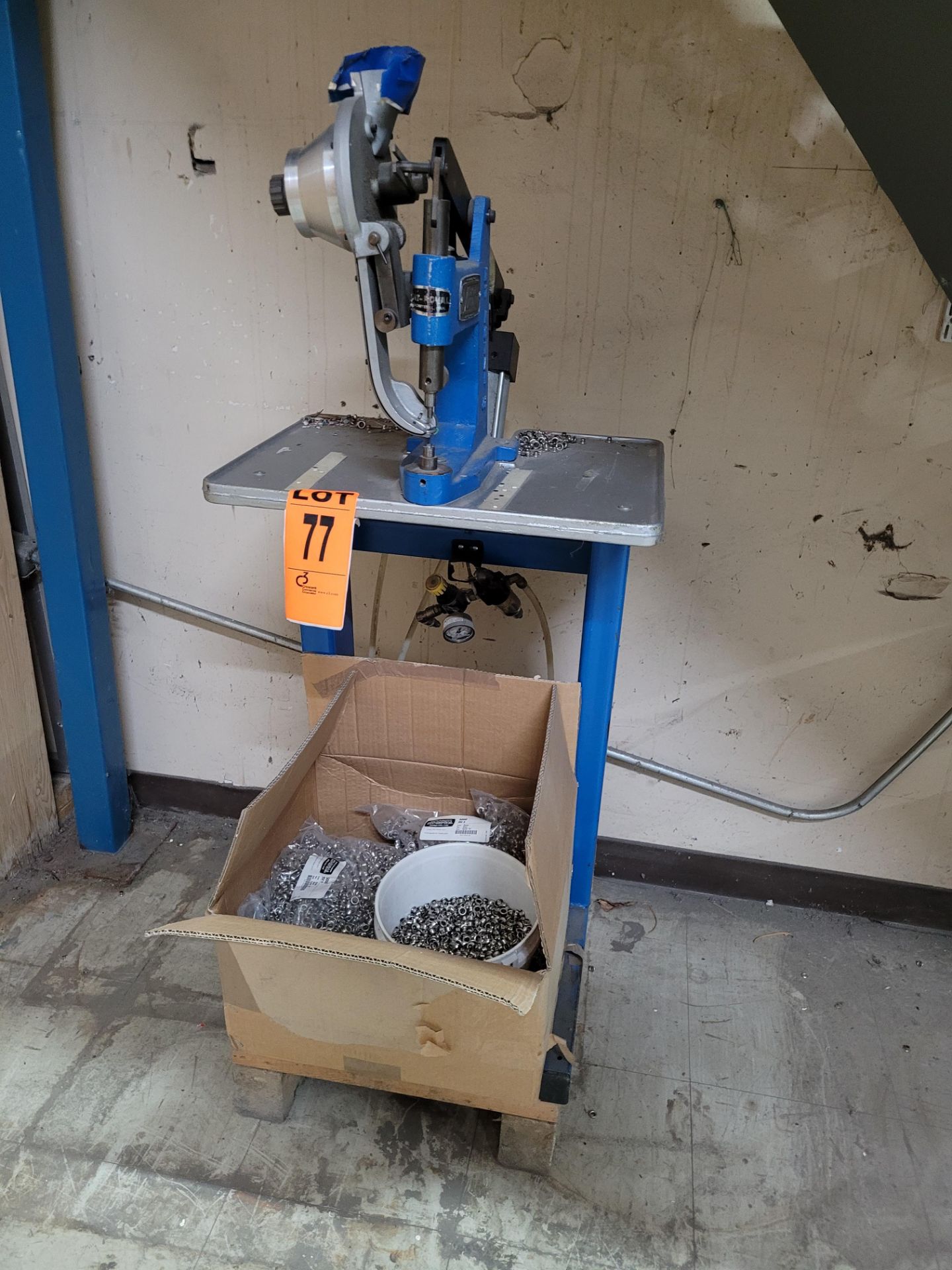 Grommet machine on steel frame, pallet, w/ inventory of Grommets