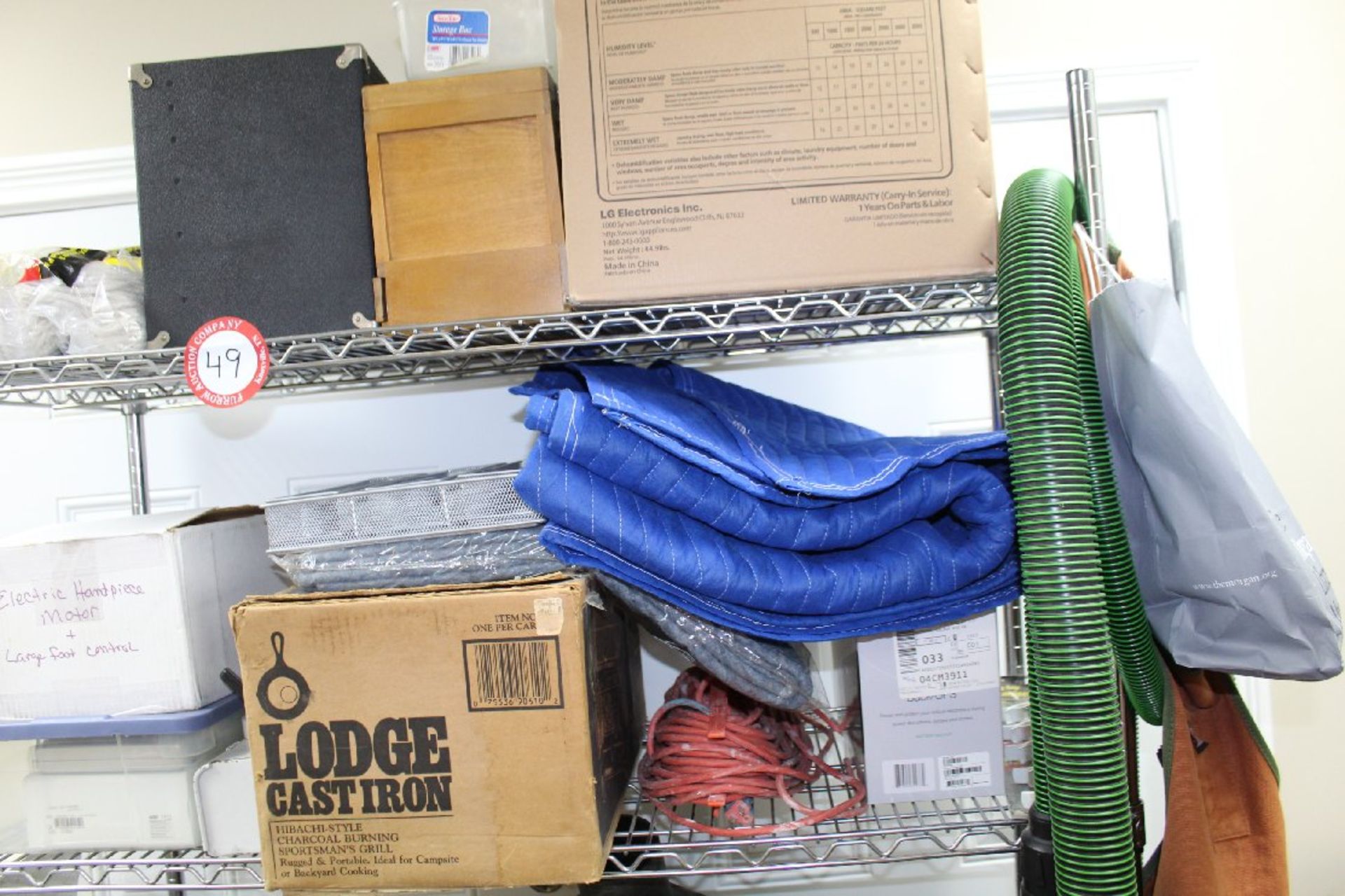 4 Shelf Metal rack Plus Contents of Top Two Shelves (cast iron grill, moving blankets, storage