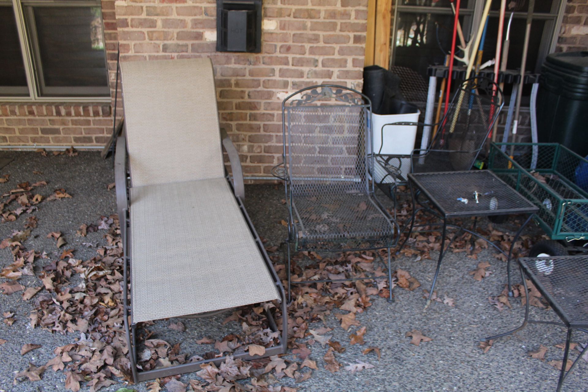 One Metal End Table, Two Metal Chairs, Assorted Garden Tools, Garden Tool Rack, Outdoor Mats,