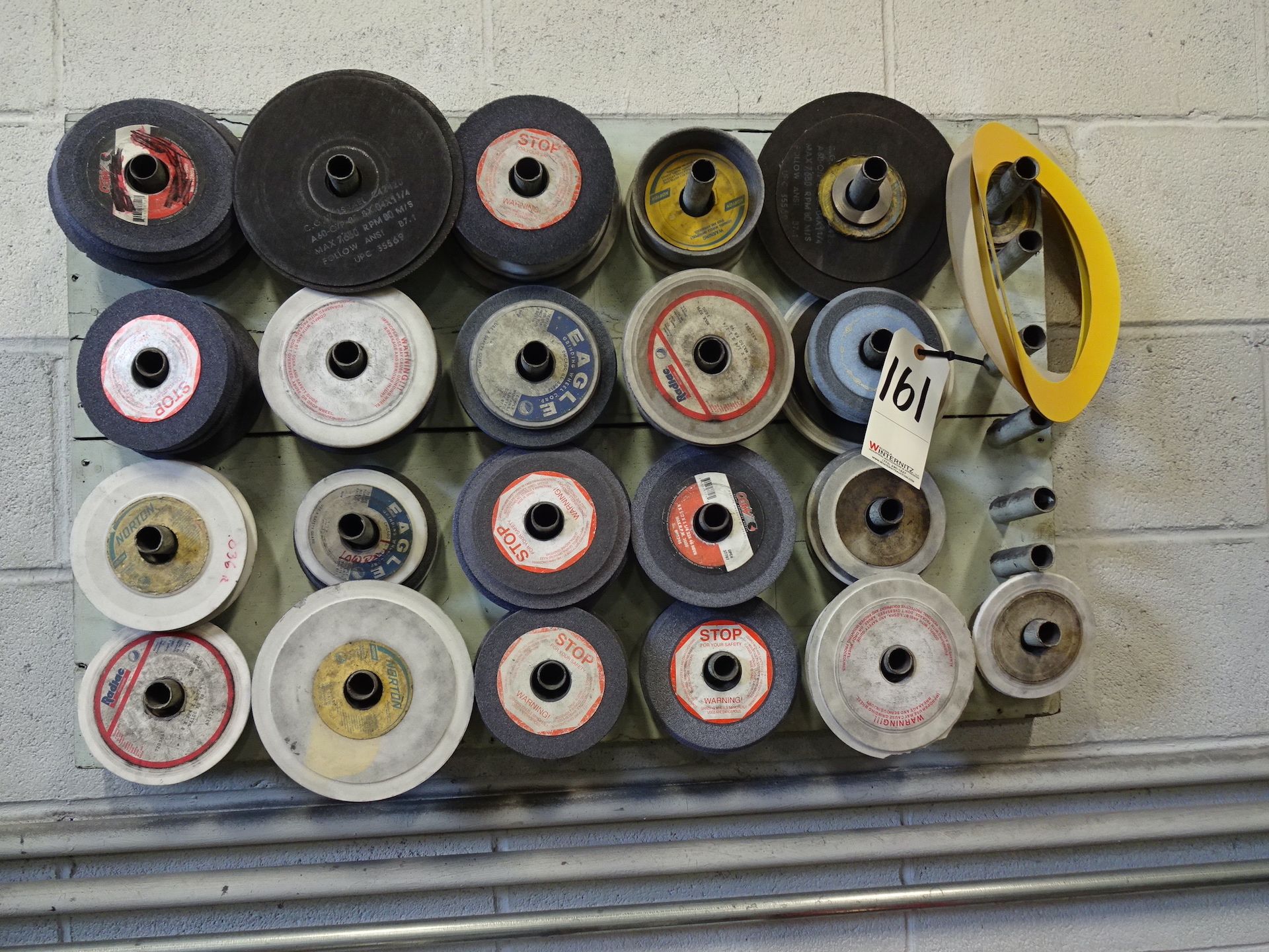 LOT: Assorted Grinding Wheels (on wall)