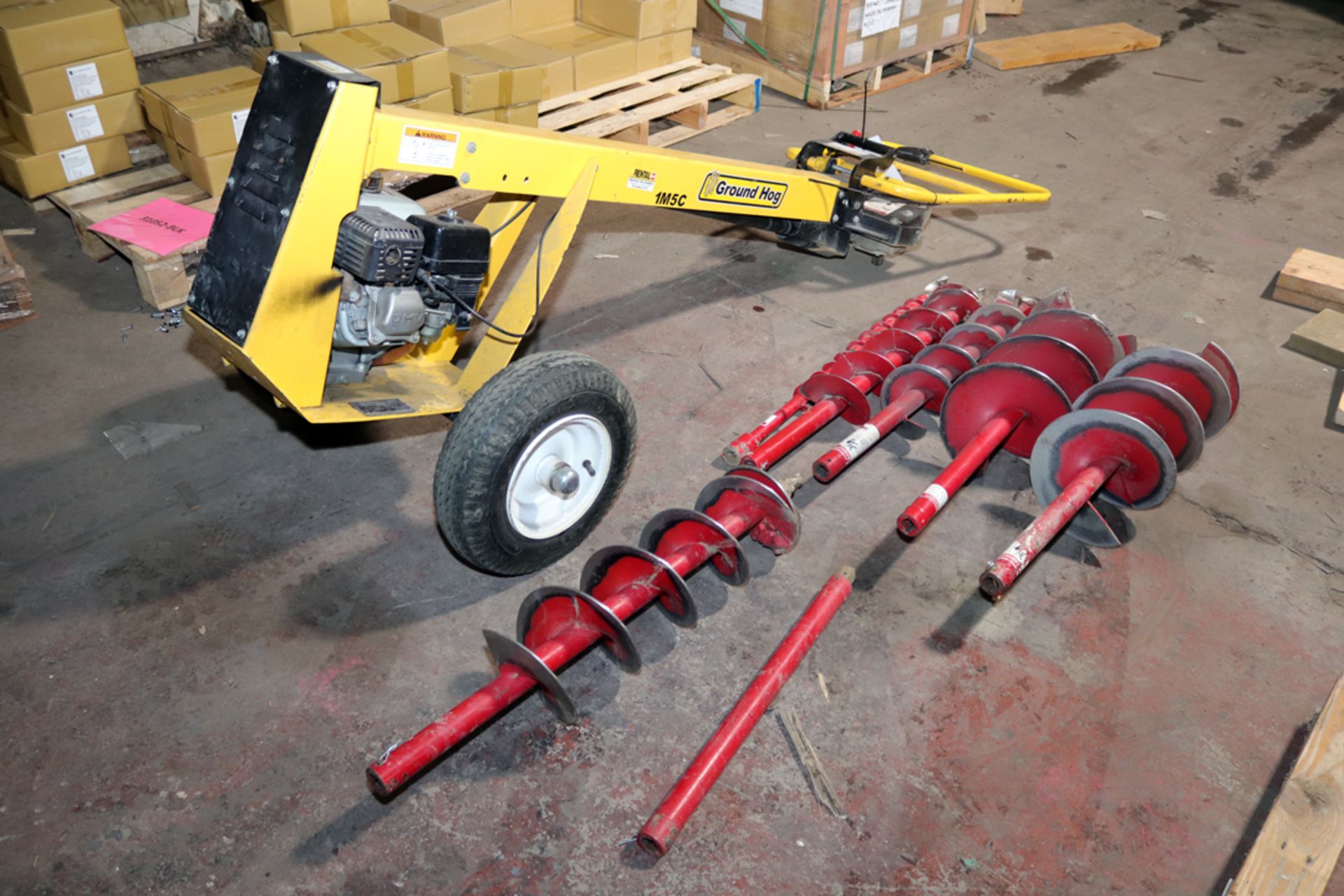 GROUND HOG 1M5C GAS POWERED 1 MAN EARTH DRILL W/ 6 VARIED AUGERS AND EXTENSION