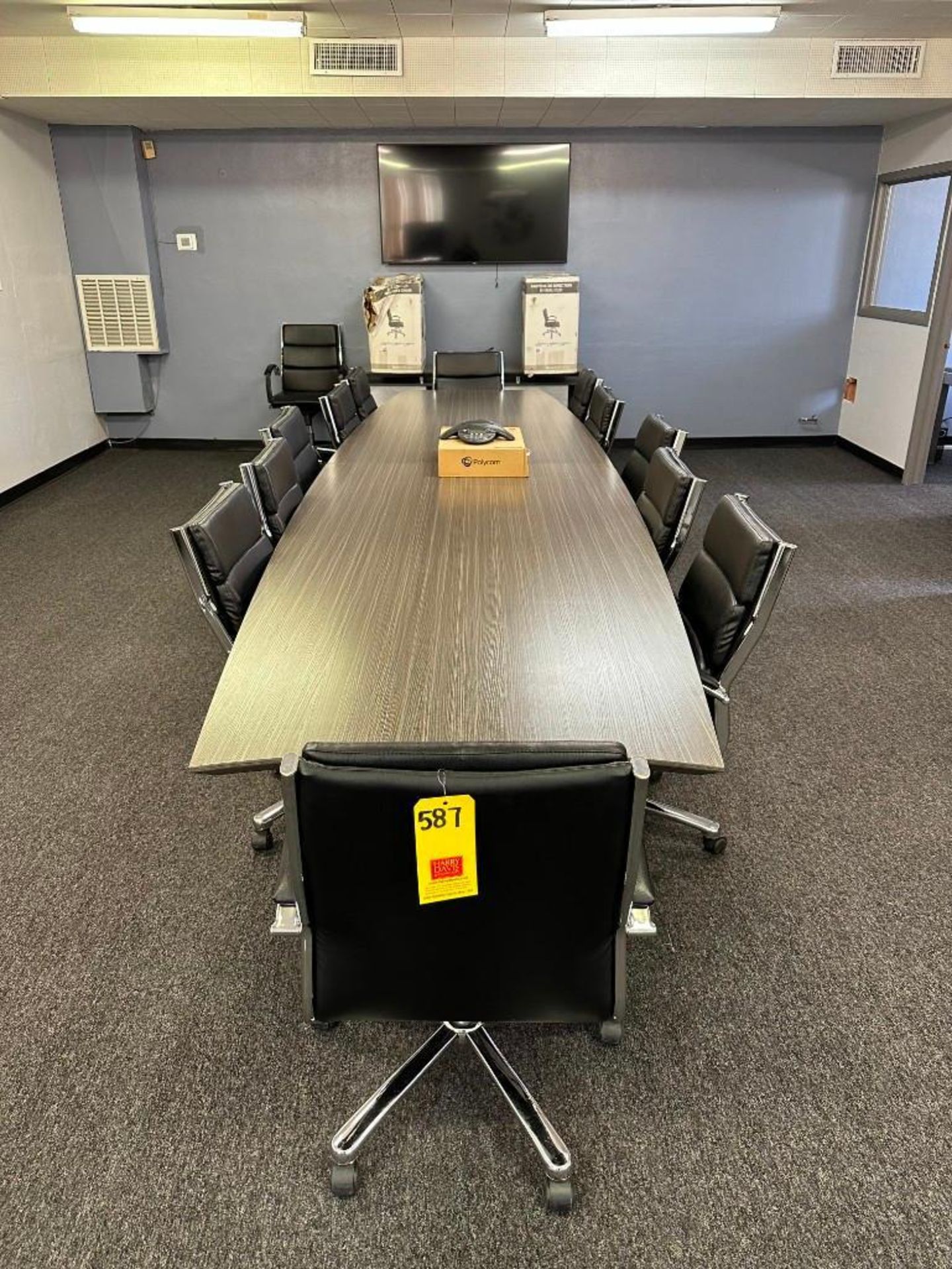 Conference Table, (15) Chairs, Samsung TV, Table, Polycom Conference Phone and Dry Erase Board