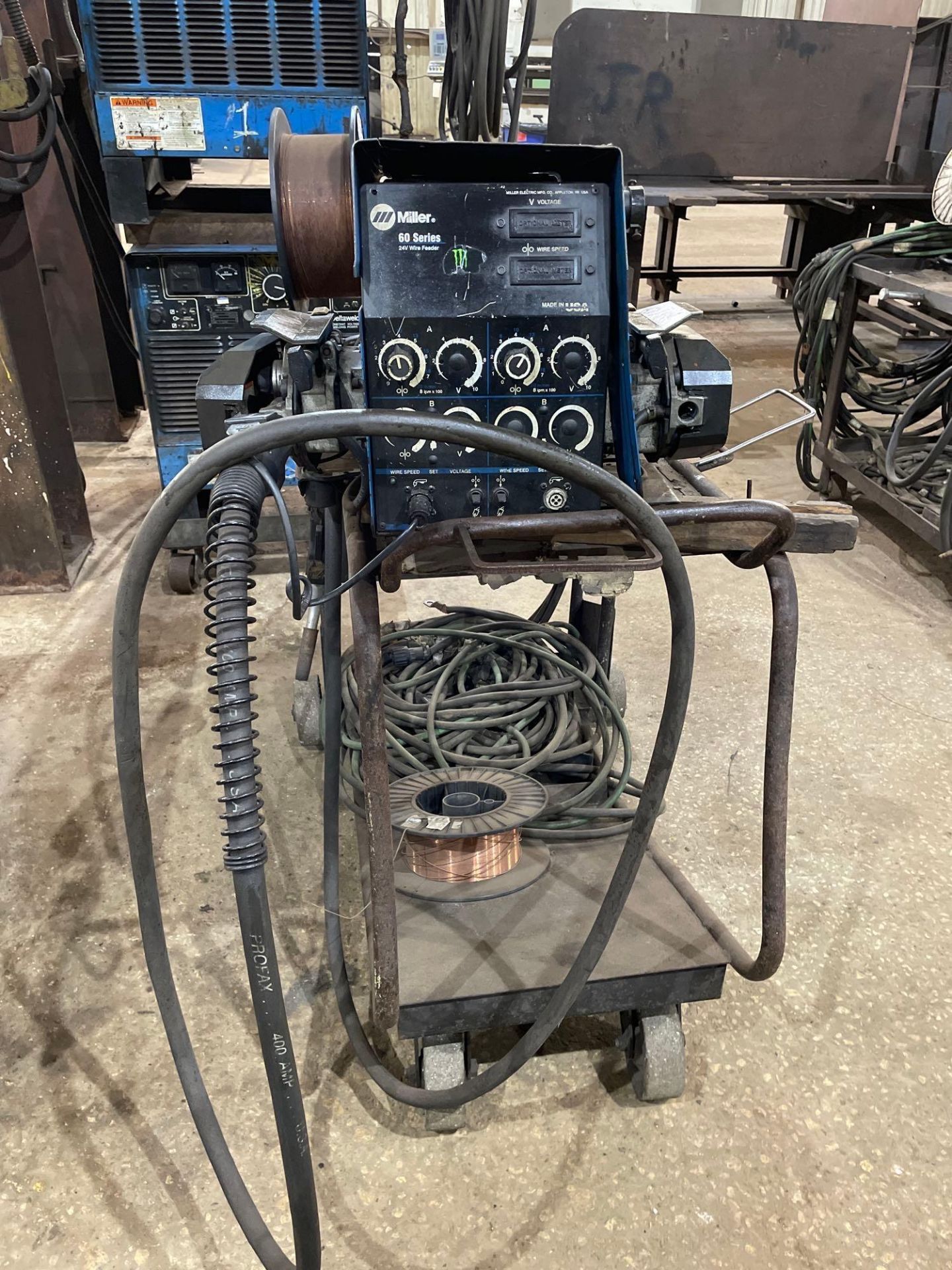 Miller 60 Series 24V Wire Feeder on Metal Cart