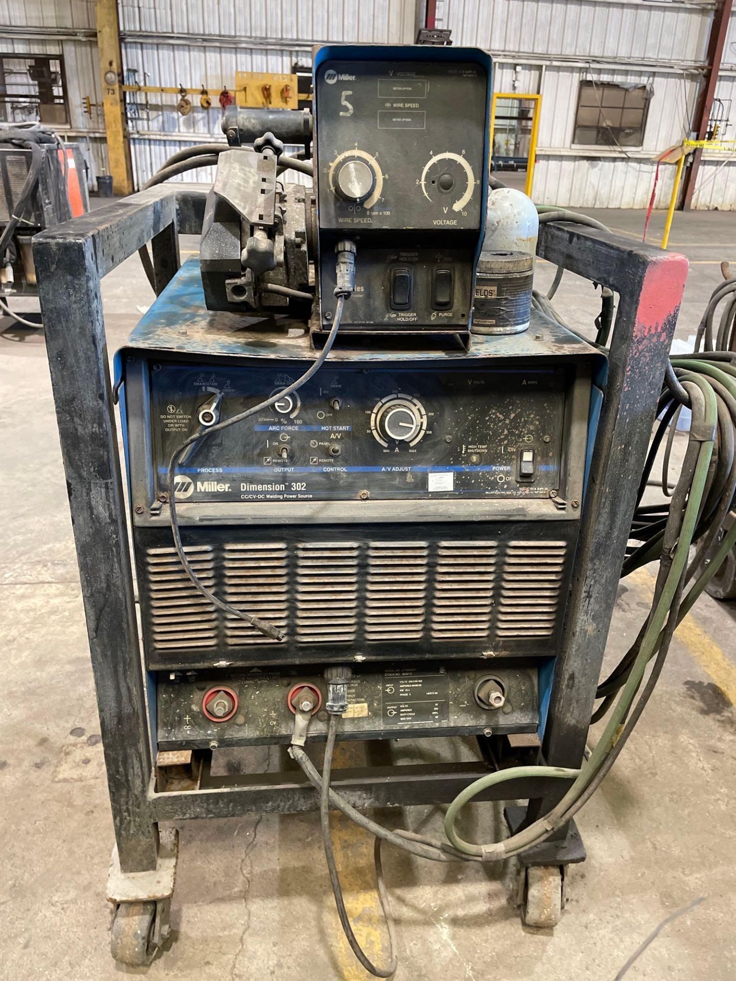 Miller Dimension 302 CC/DC Welding Power Source, with 70 Series 24V Wire Feeder.