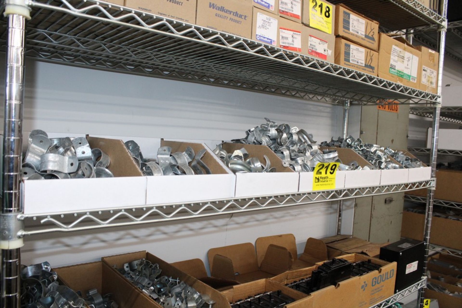 ASSORTED CONDUIT HANGERS ON SHELF