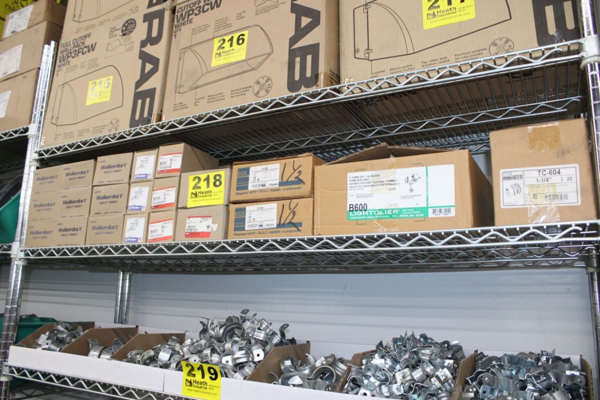 ASSORTED CONDUIT HANGERS AND FITTINGS ON SHELF