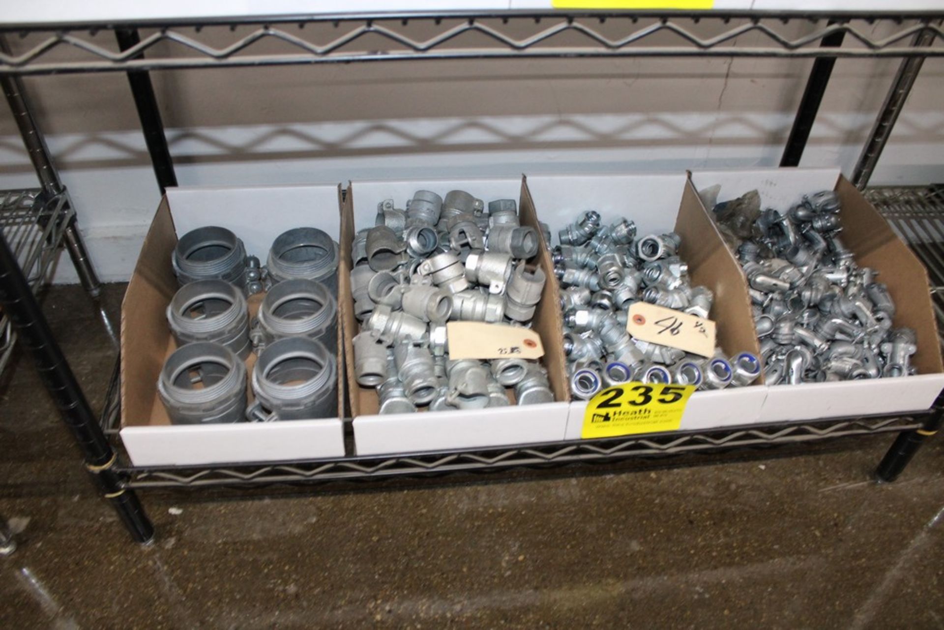 ASSORTED CONDUIT FITTINGS AND ELBOWS ON SHELF