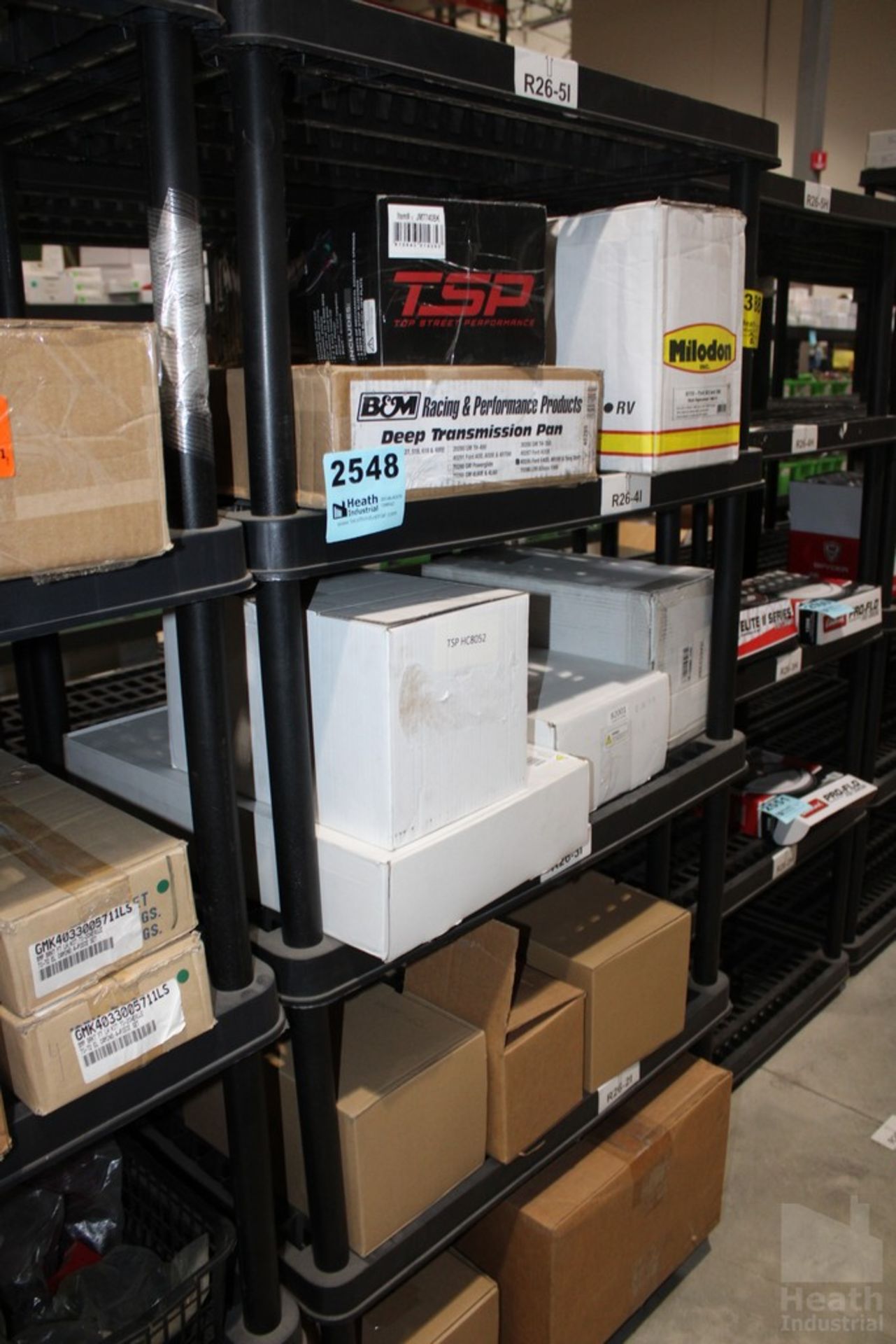 PARTS ON SHELVES INCLUDING, MILODON PICKUP WITH OIL PUMP, FORD E40D4R100 DEEP TRANSMISSION PAN AND